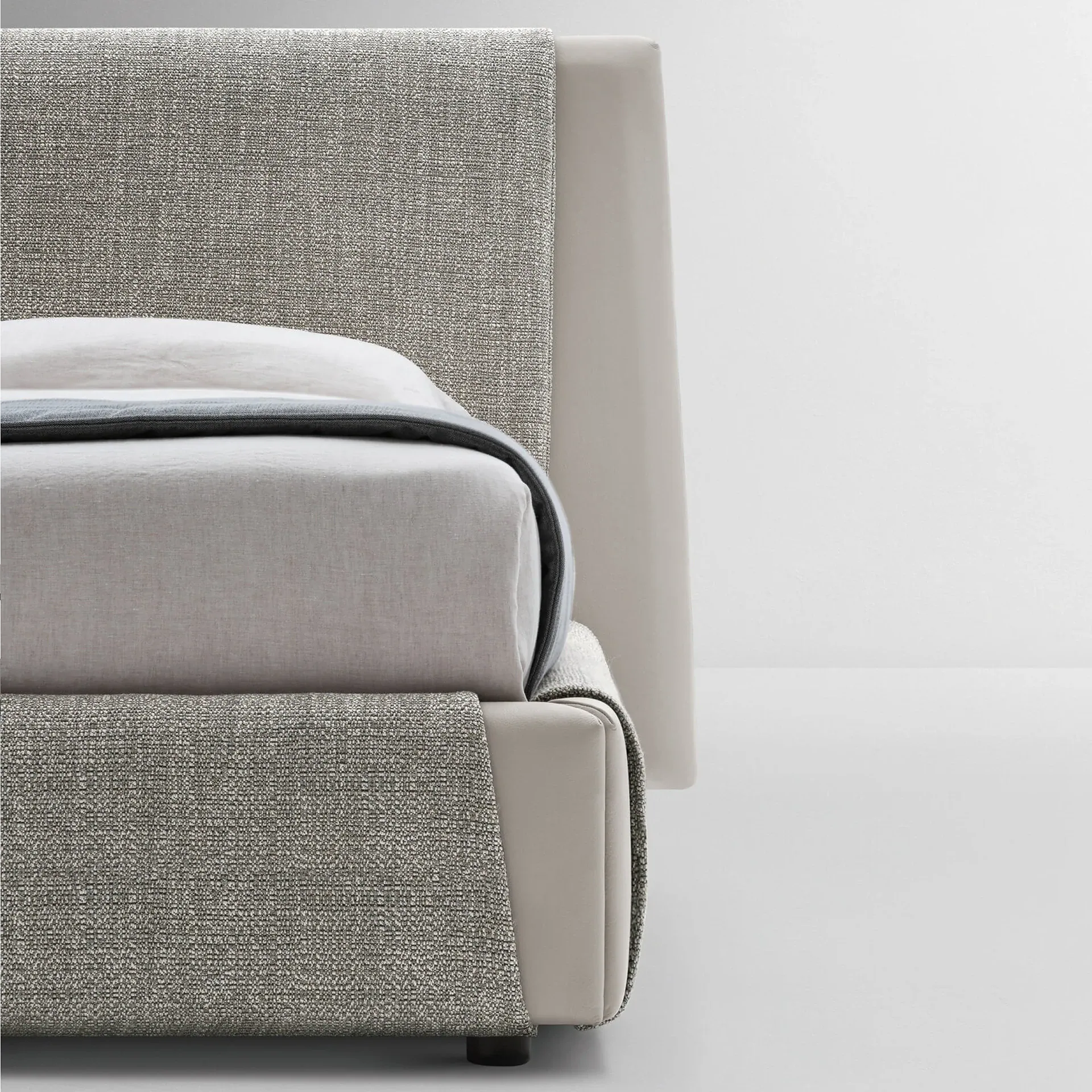 Kailua Bed close-up showing upholstered headboard and base.
