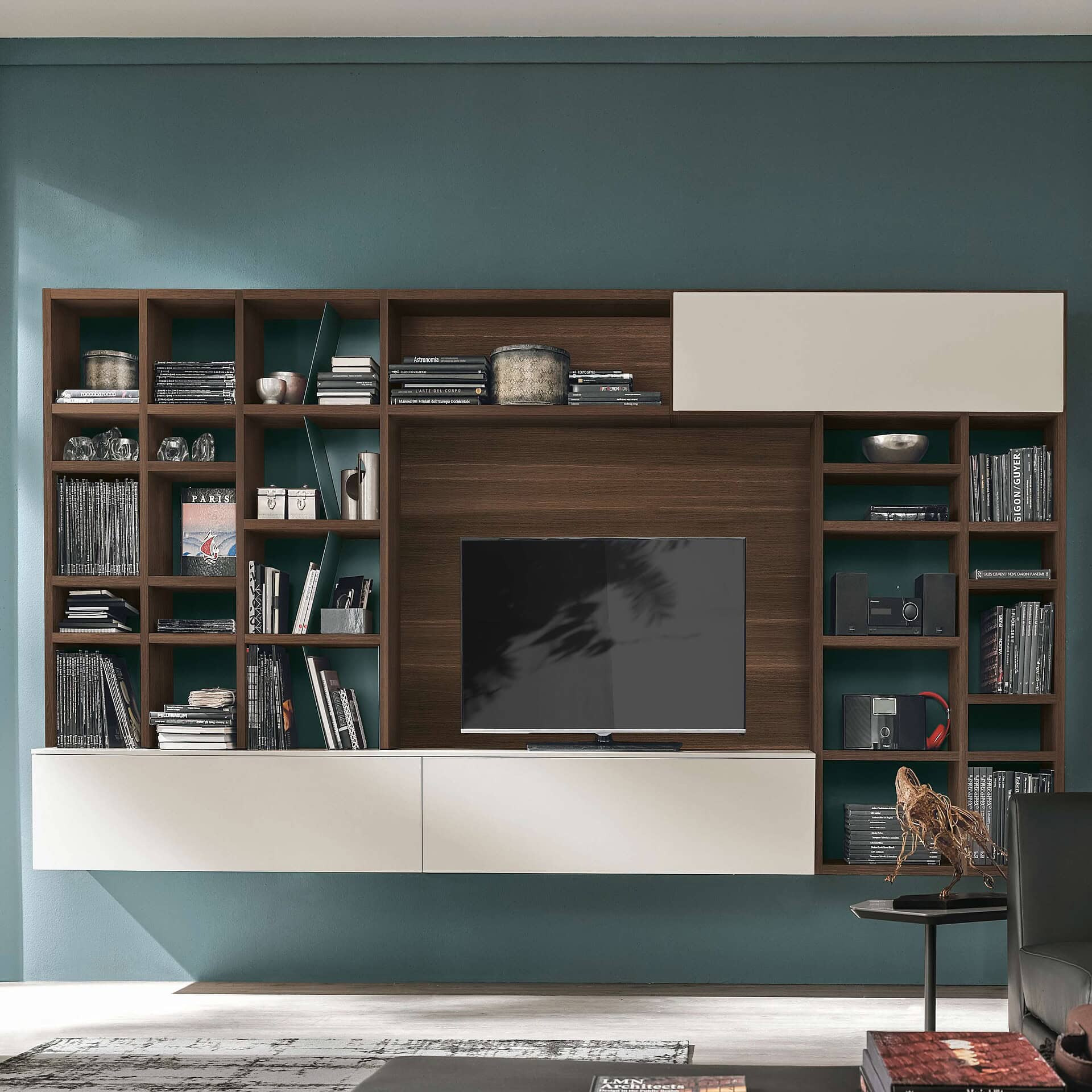 Contemporary wall unit with wooden shelves and storage for modern living room decor.