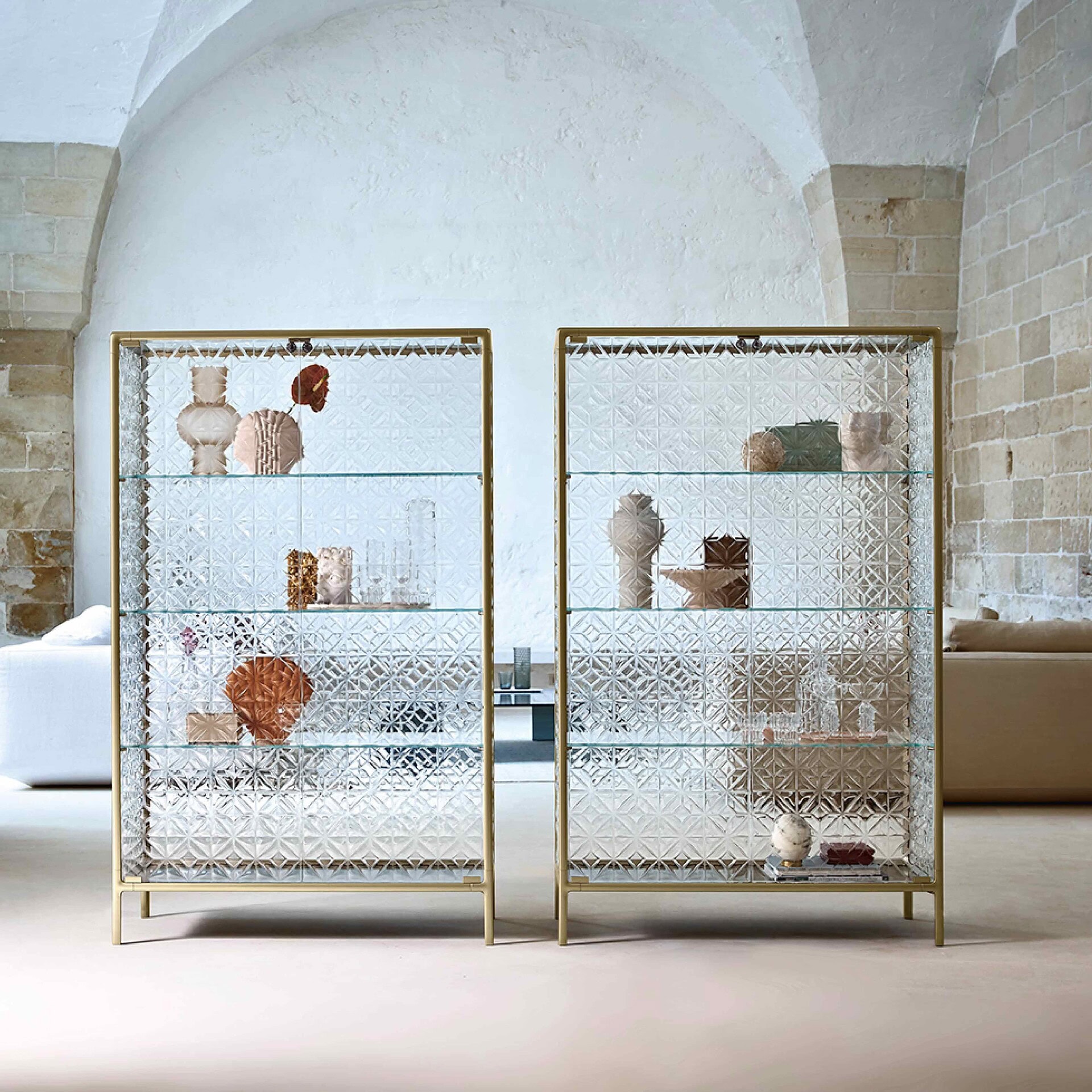 Elegant glass display cabinet with intricate geometric patterns, perfect for showcasing stylish decor.