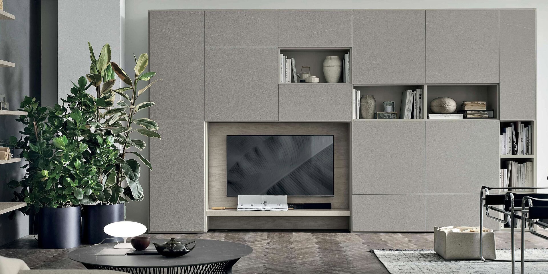 Contemporary living room with modern built-in TV wall and minimalist decor.