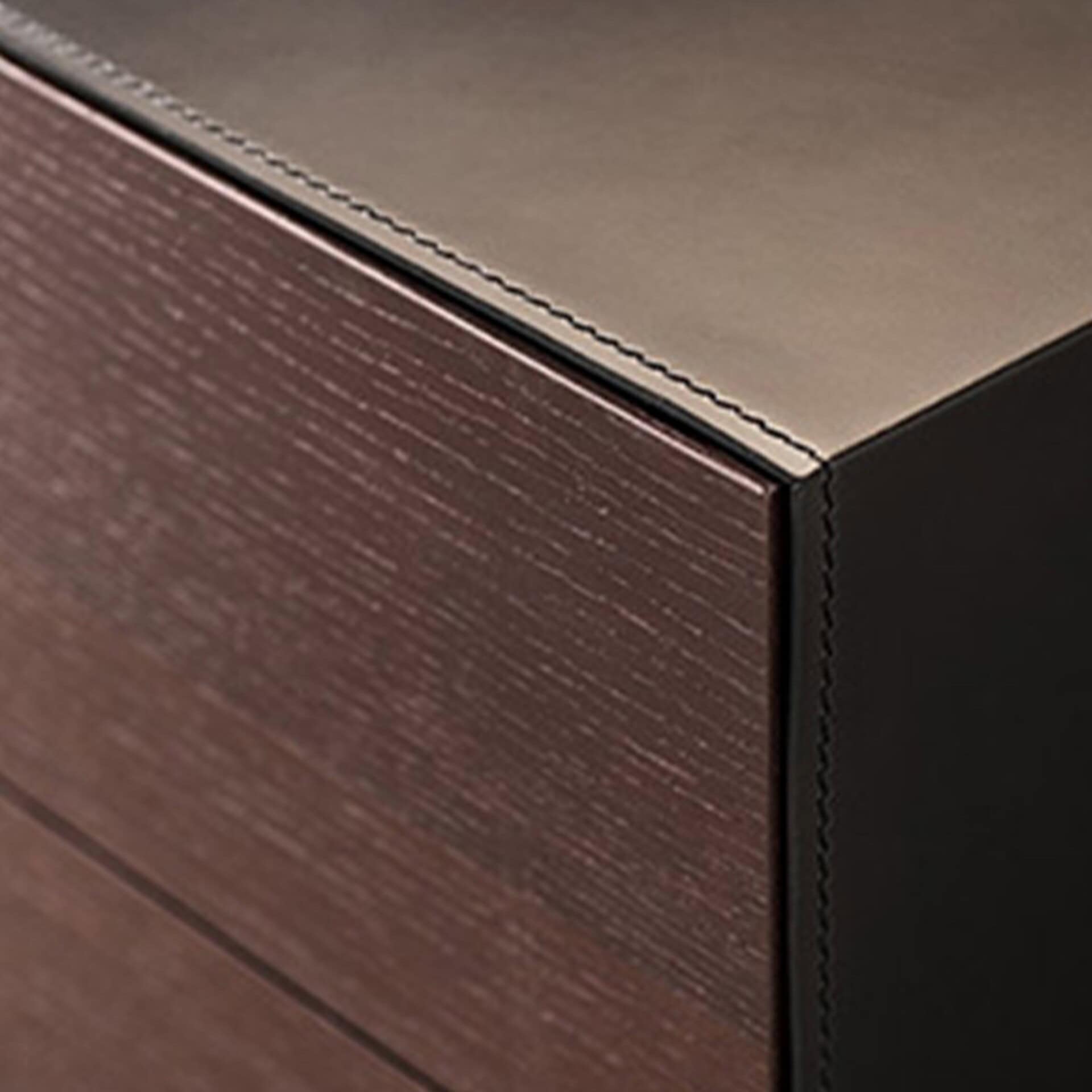 Sleek modern wood and black metal furniture detail, showcasing contemporary design and craftsmanship.
