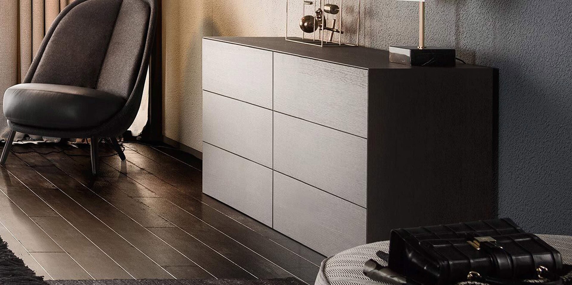 Modern black and white dresser with sleek design, in a contemporary styled room.