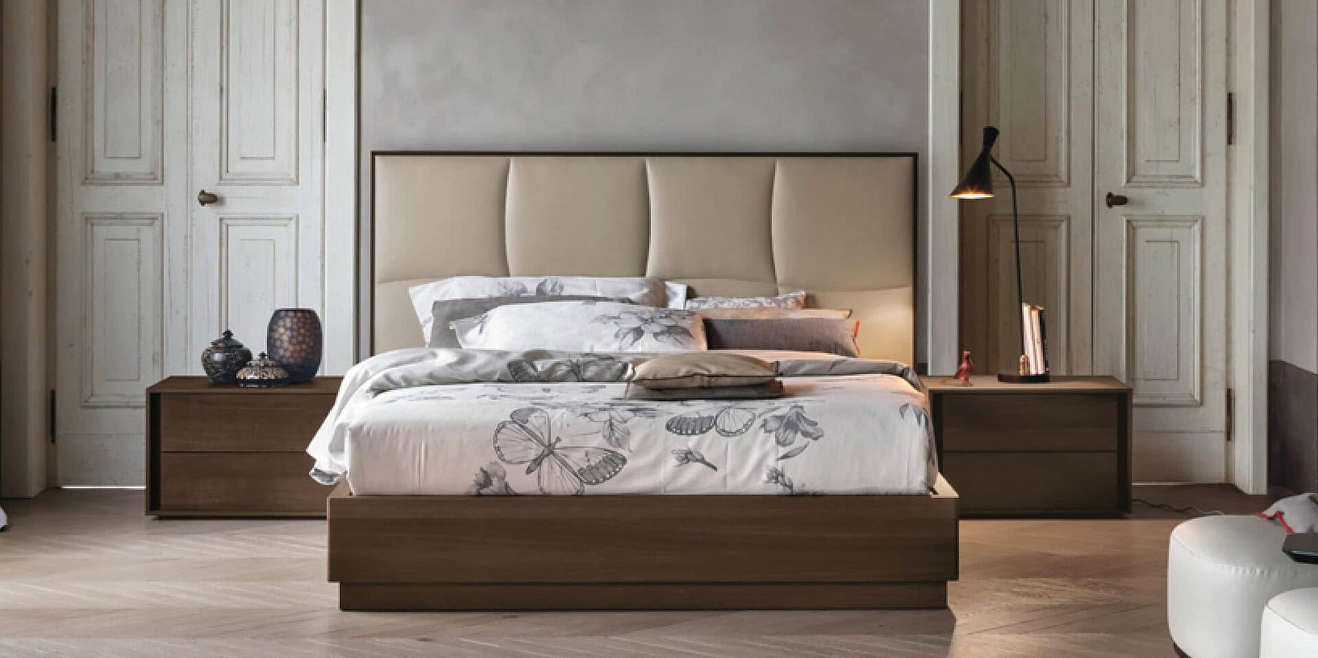 Elegant modern bedroom with custom wood furnishings and plush bedding for a luxurious interior design look.