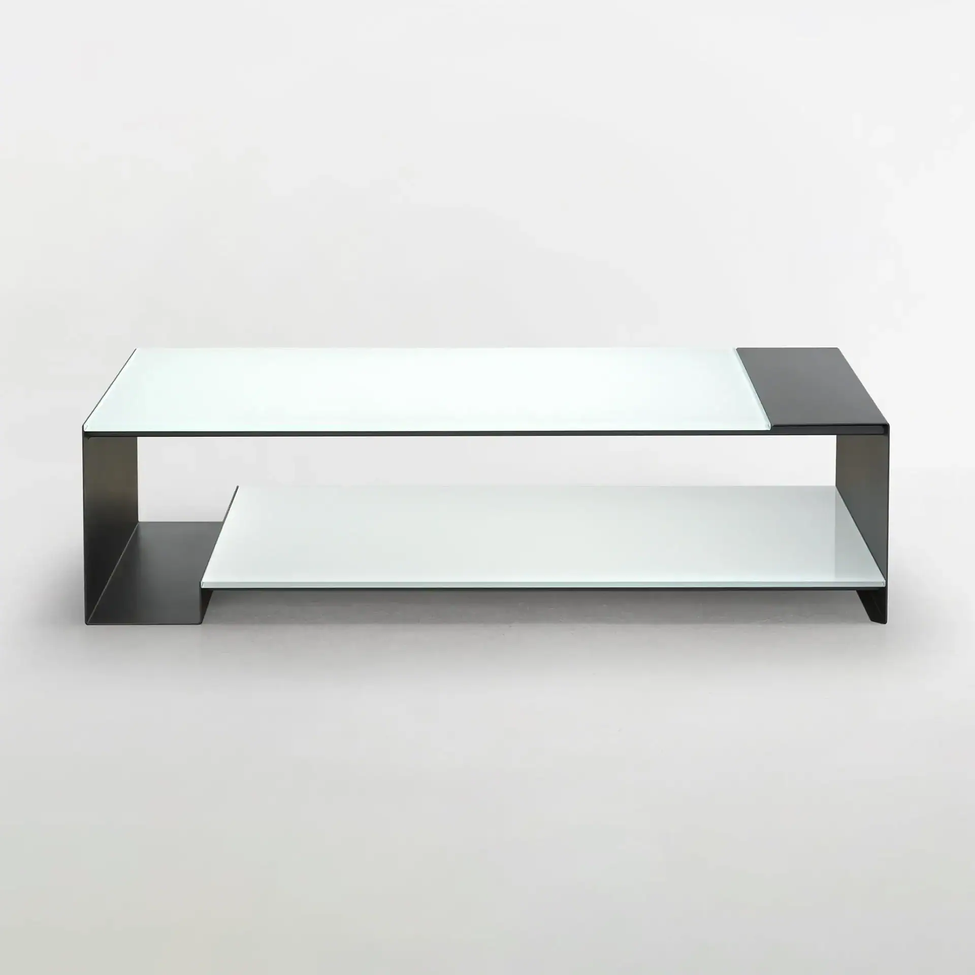 Sklar Furnishings Duo Table with glass top and black metal frame.