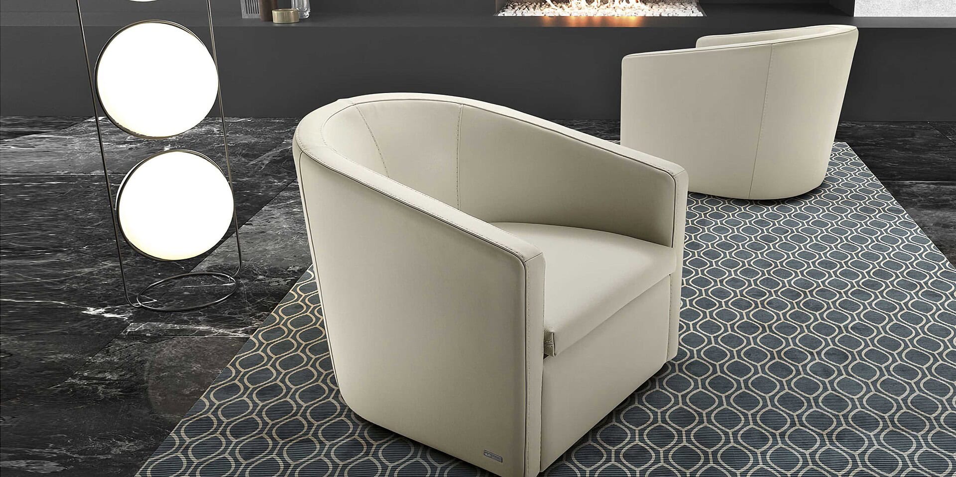 Luxurious white leather armchairs from Sklar Furnishings, perfect for modern living rooms.