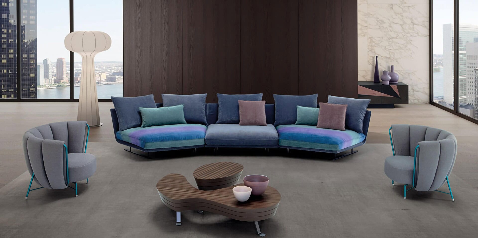 Contemporary living room with modern sofa, armchairs, and stylish decor in a high-rise apartment.