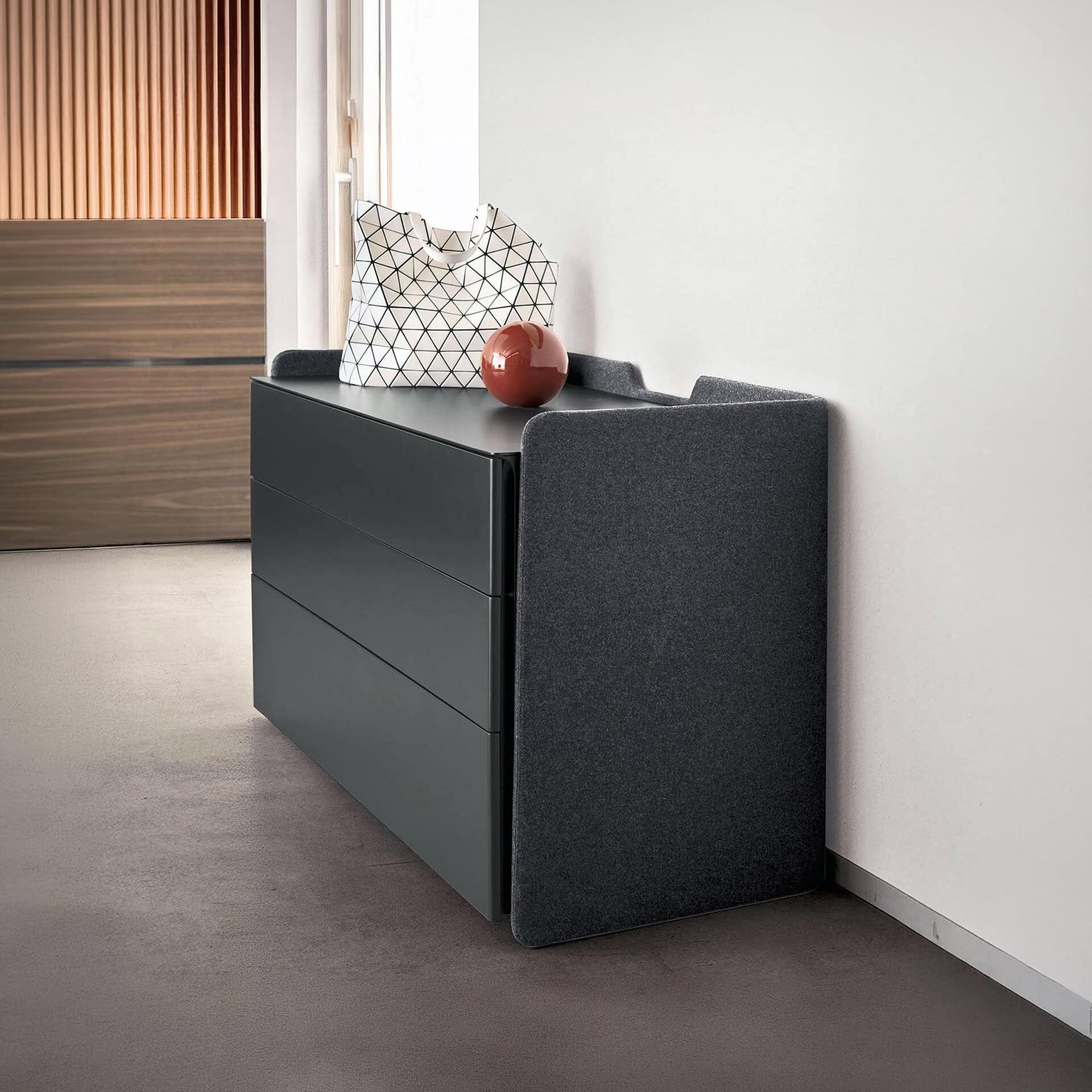 Elegant Chloé upholstered 3-drawer dresser with sleek design and soft fabric finish. Perfect for mod.