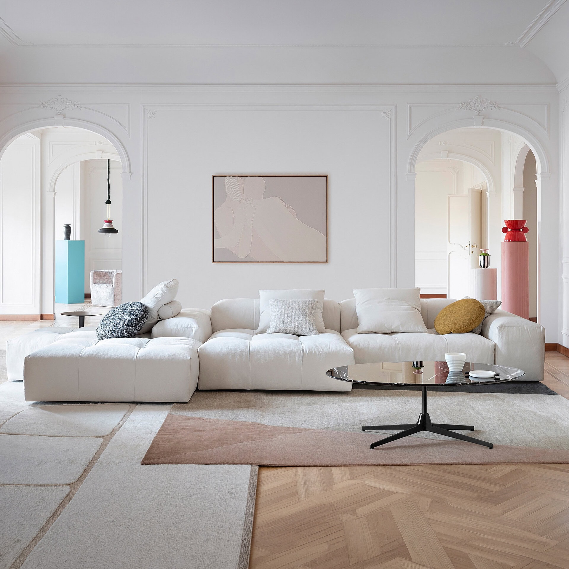 Elegant modern white sectional sofa in a stylish living room setting.