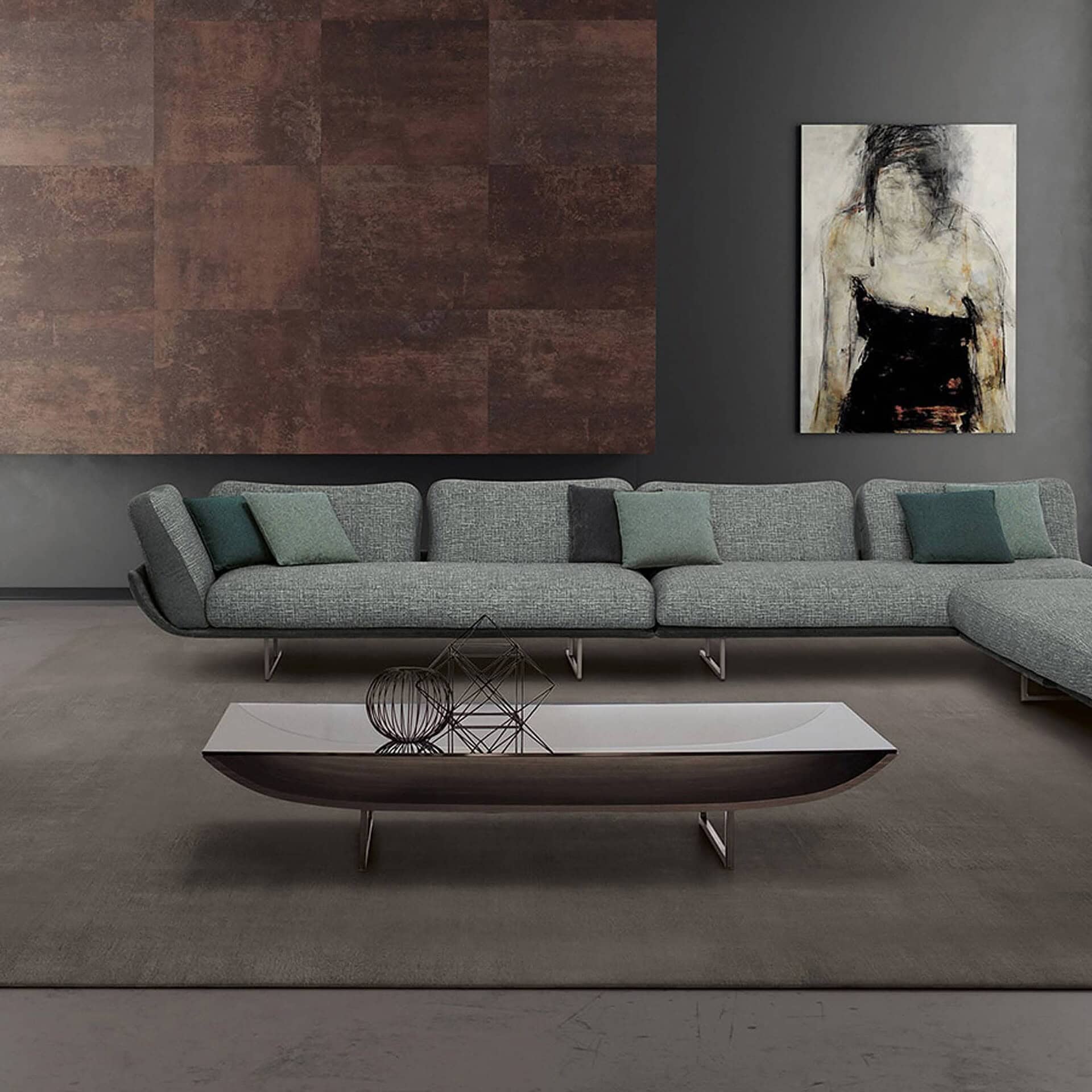 Lifestyle view of the Zaren Coffee Table in a modern living room with sectional sofa and artwork on the wall