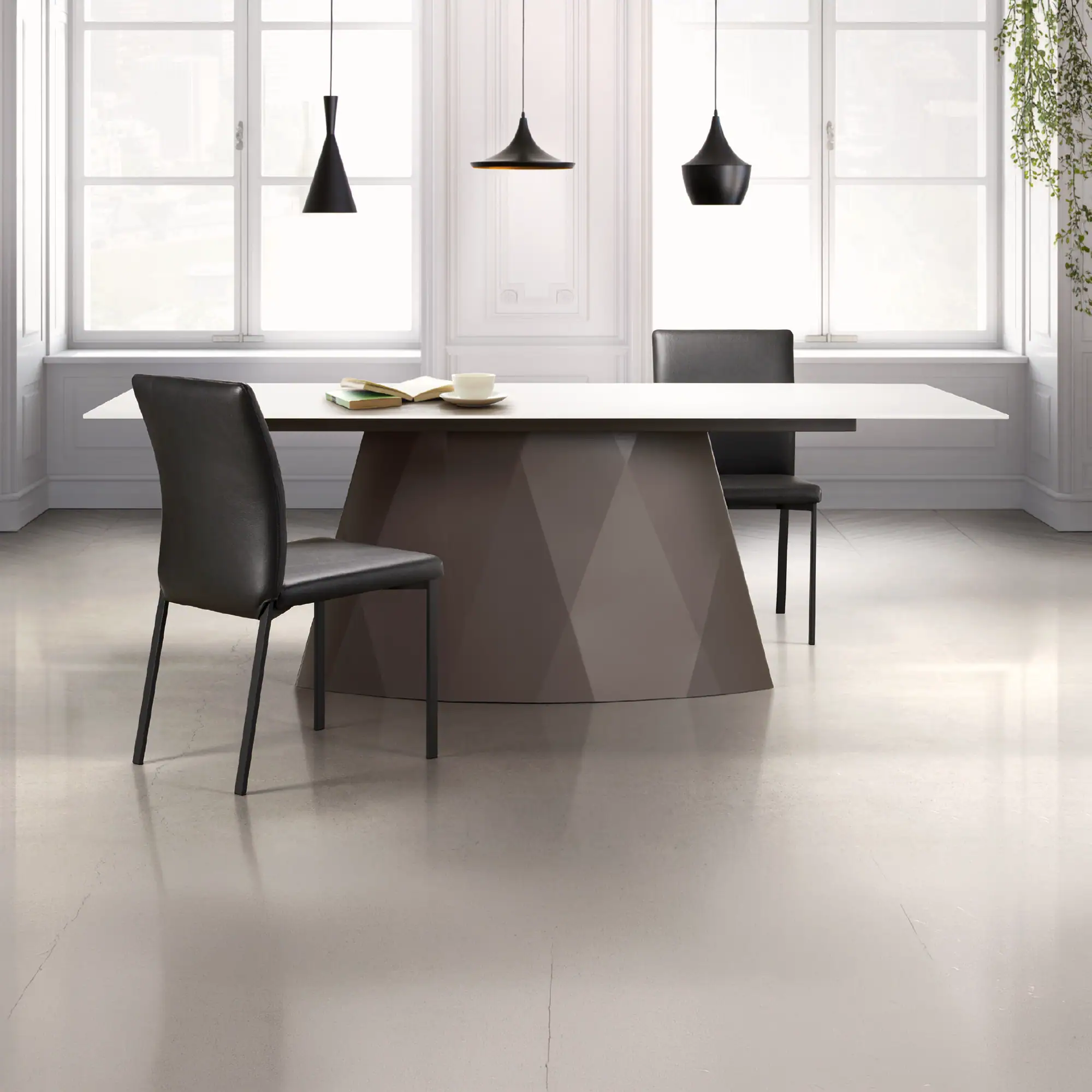 Sklar Furnishings Diamond Dining Table with black chairs in a bright room.