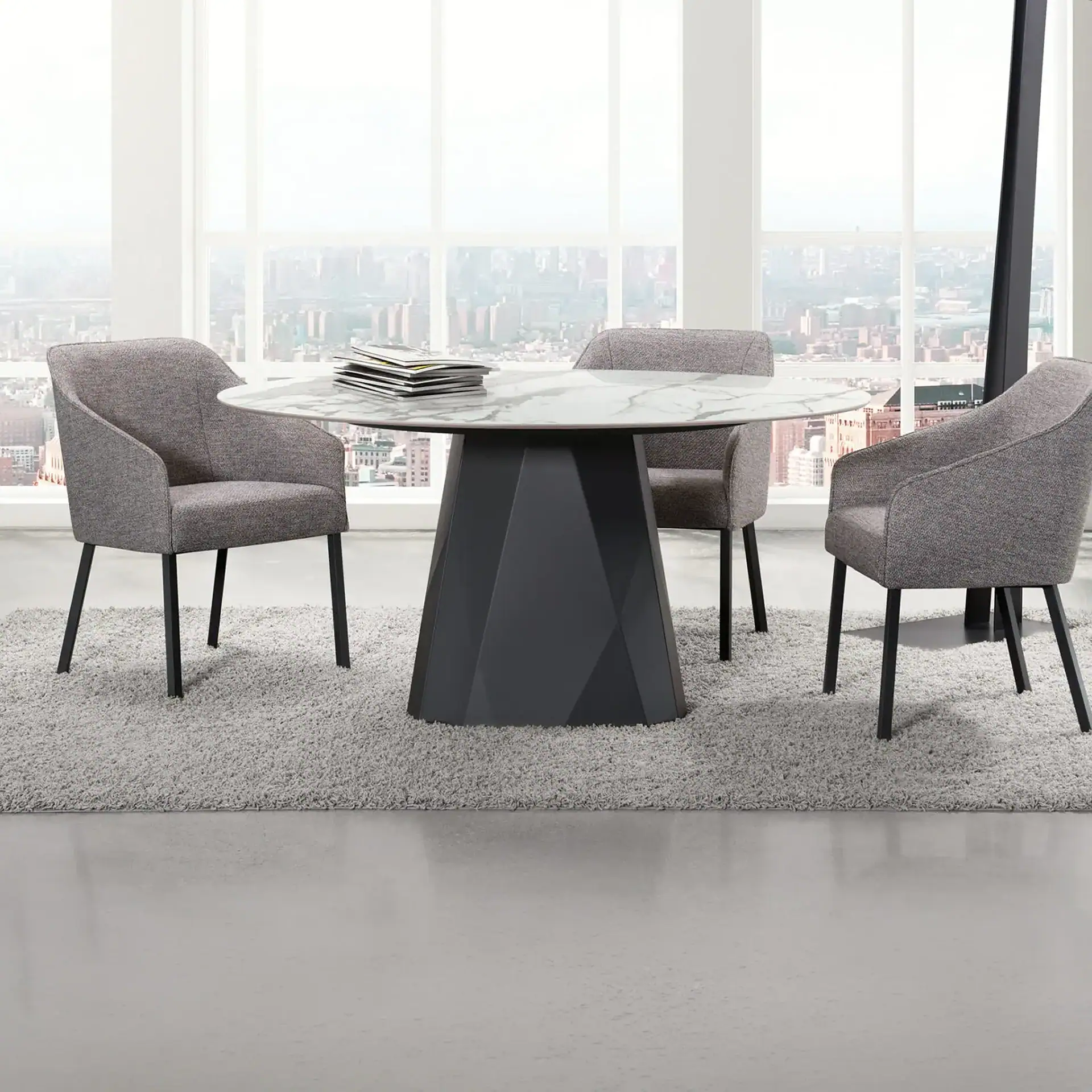 Sklar Furnishings Diamond Dining Table with four chairs in a modern high-rise setting.
