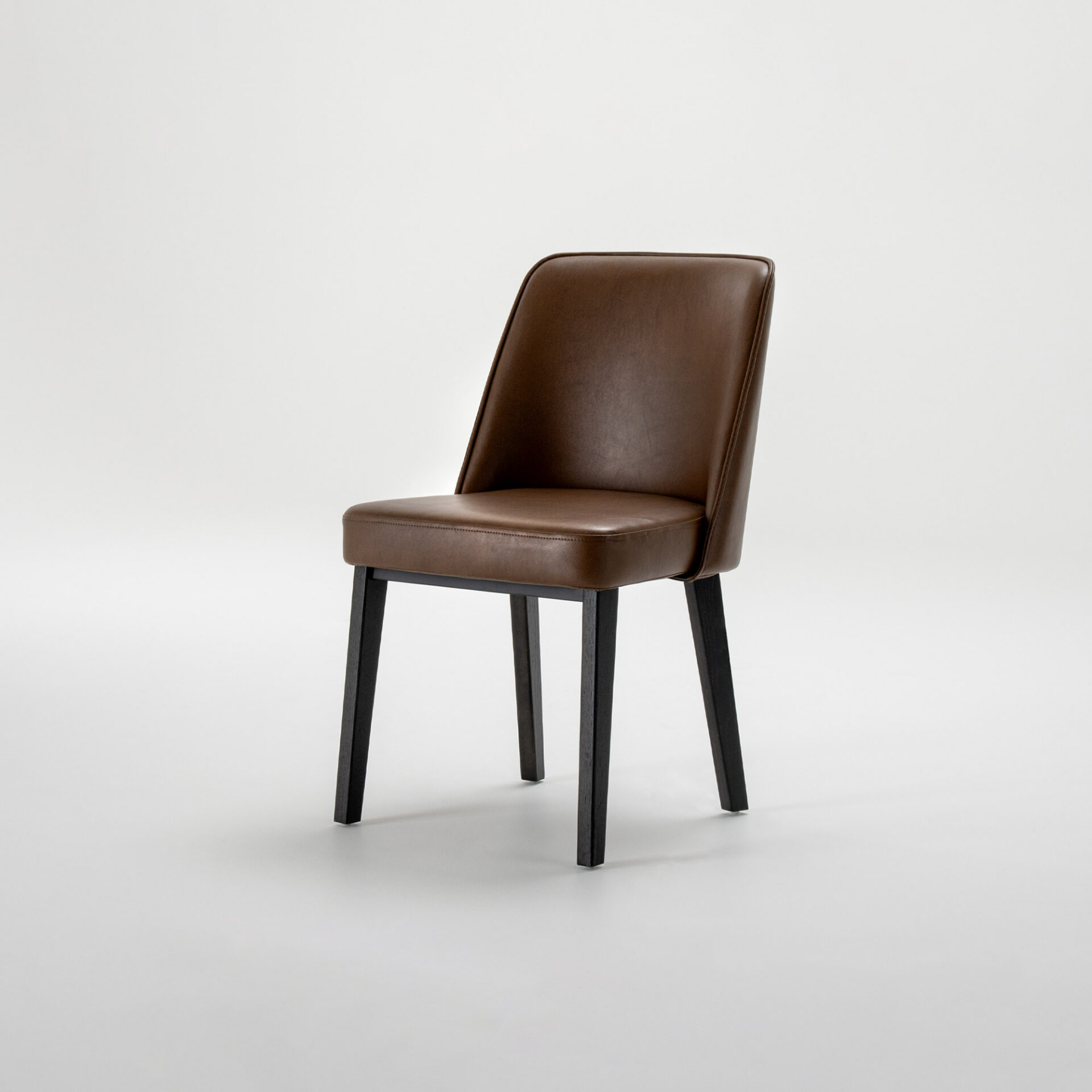 A modern dining chair with brown leather upholstery and dark wooden legs, set against a light gray background.