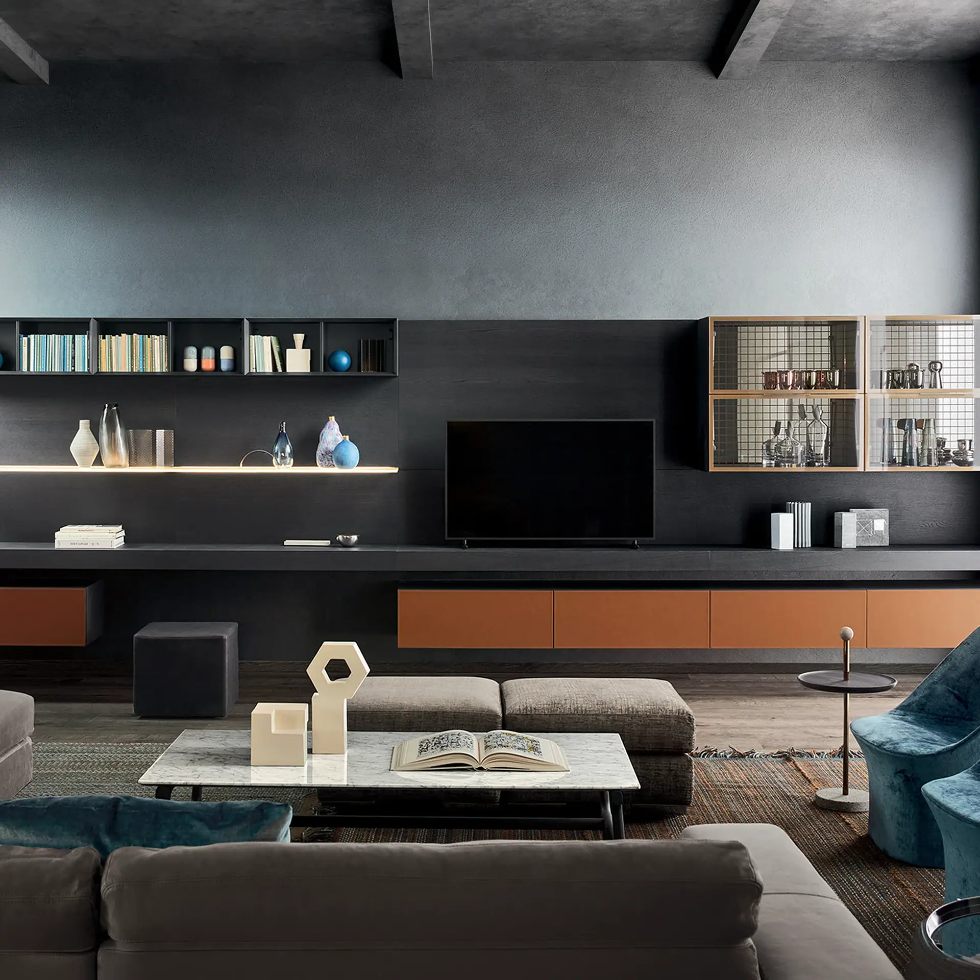 A stylish modern living room with a large TV, dark media unit, marble coffee table, and teal velvet armchairs.