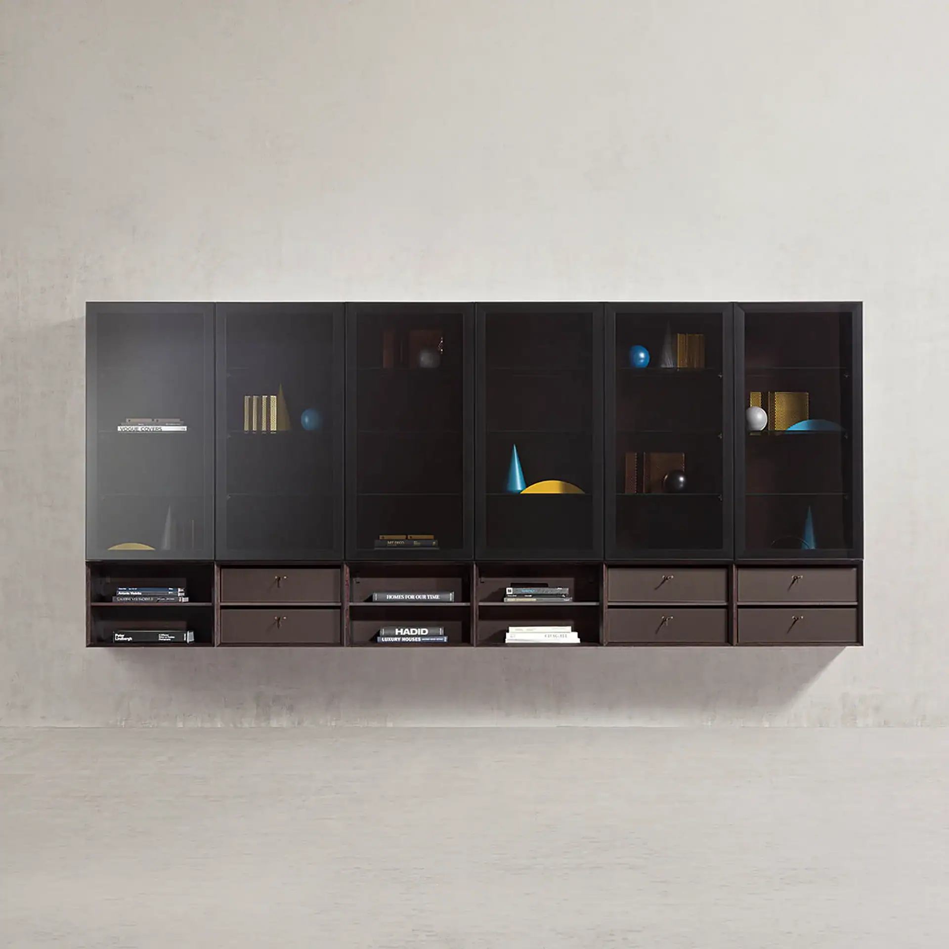 A dark, wall-mounted storage unit with smoked glass cabinets, open shelves, and brown drawers, filled with books and decorative objects, against a light grey wall.