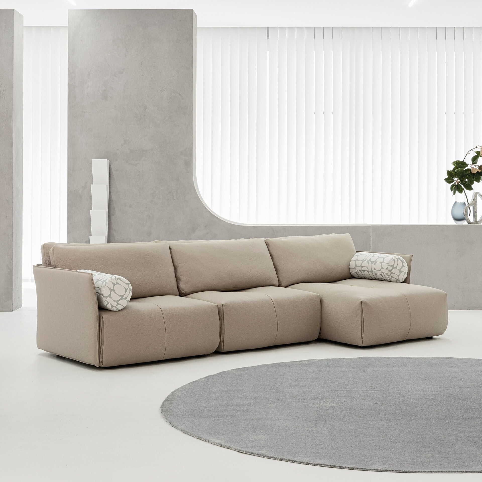 Tab F Sofa in a minimalist white living room with soft neutral tones.