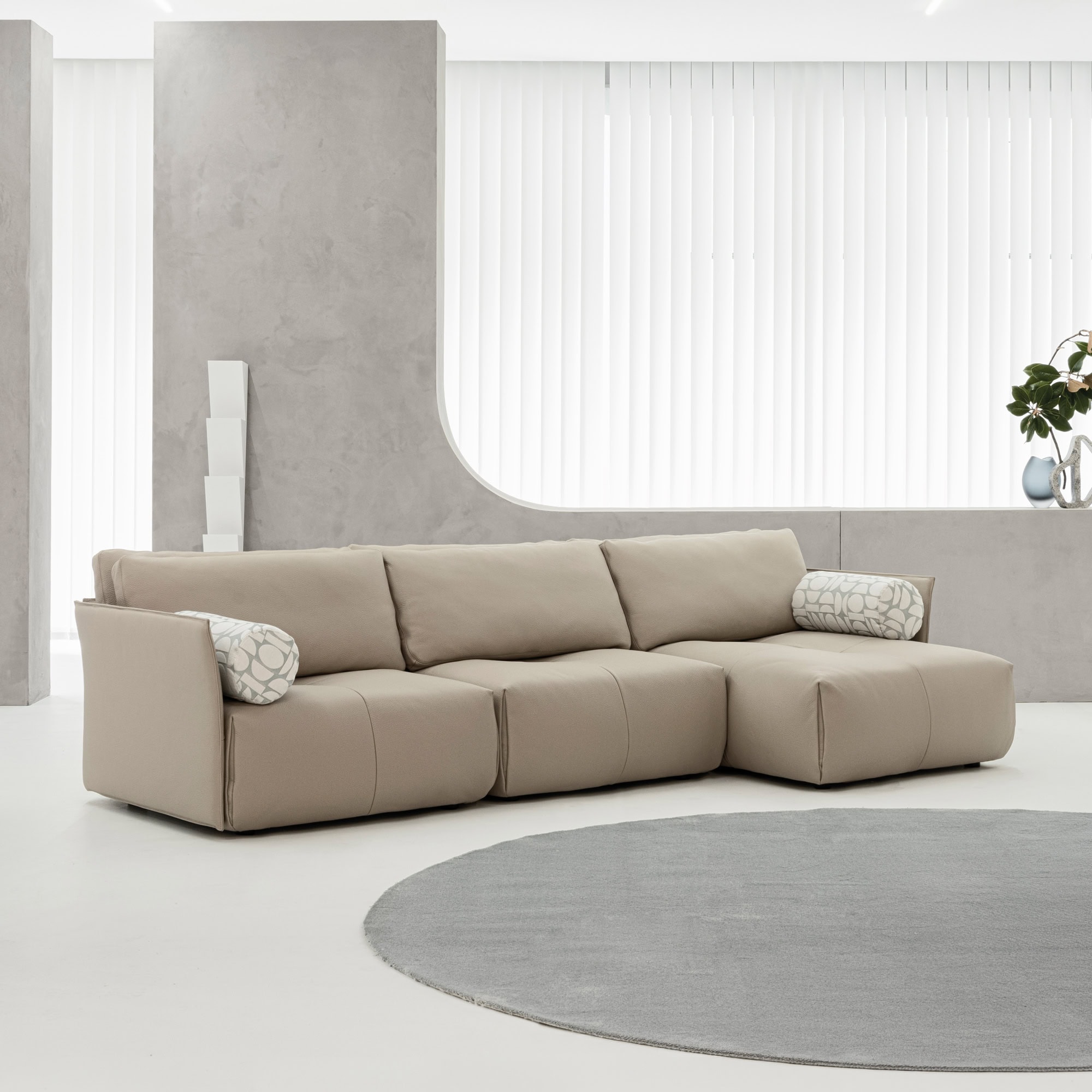 Tab F Sofa in a minimalist white living room with soft neutral tones.