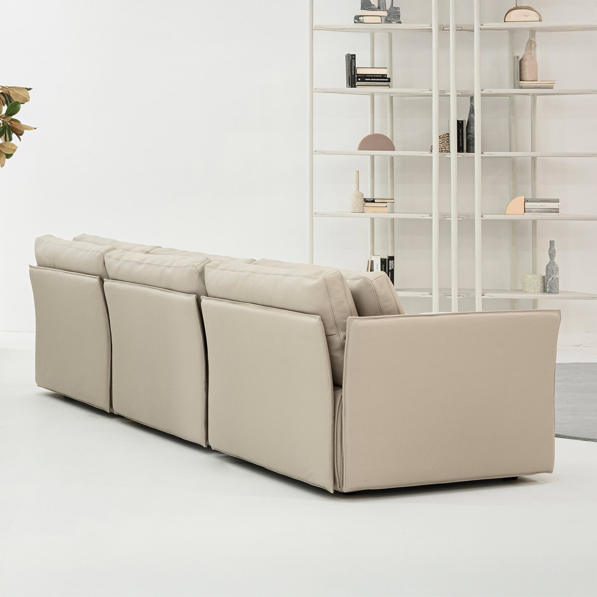 Rear view of the Tab F Sofa in light fabric, highlighting clean lines and structure.
