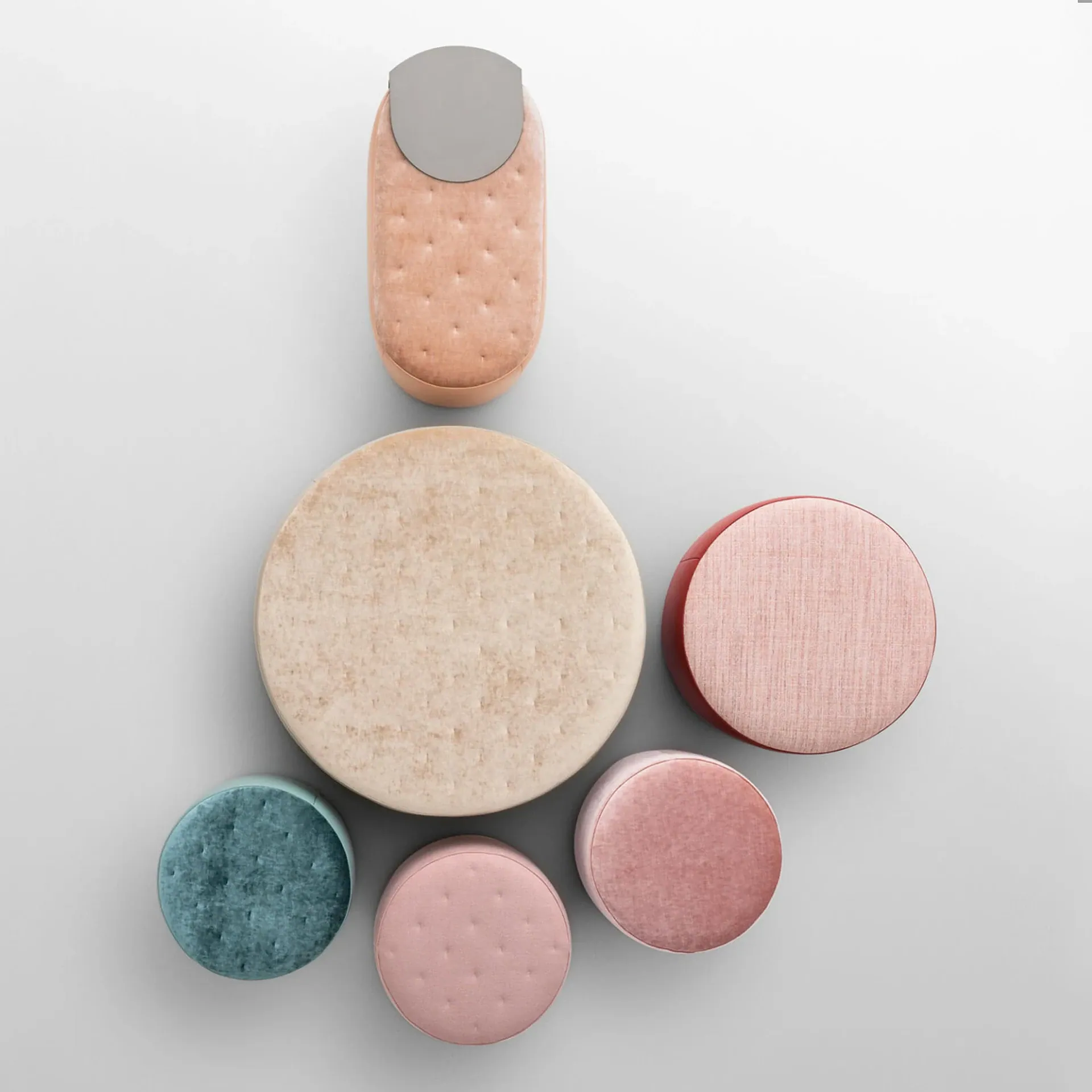 Sklar Furnishings round and cylindrical soft pink and beige furniture pieces arranged on a light.