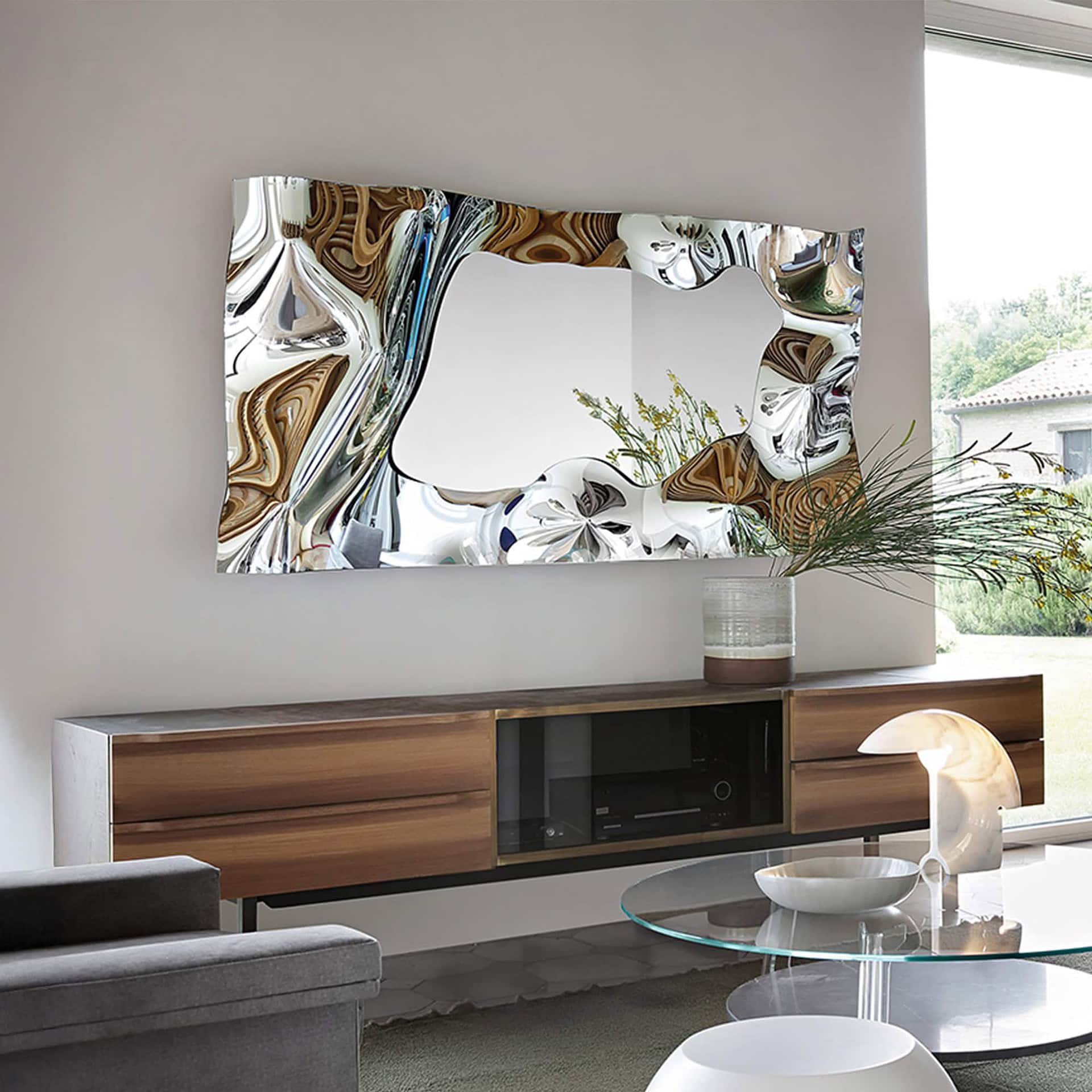 Christine Mirror in rectangular format styled above a modern console in a living room.