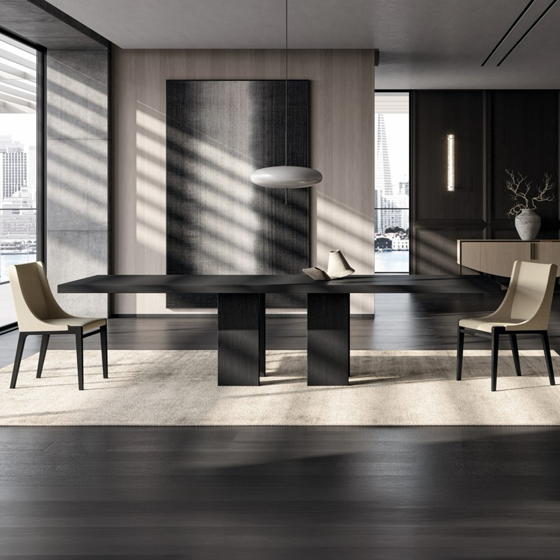 A modern dining room with a dark rectangular dining table, two light beige chairs, and a city skyline and water view through large windows. Natural light casts diagonal shadows across the room, which features dark wood floors, light wood wall panels, and a sleek pendant light.