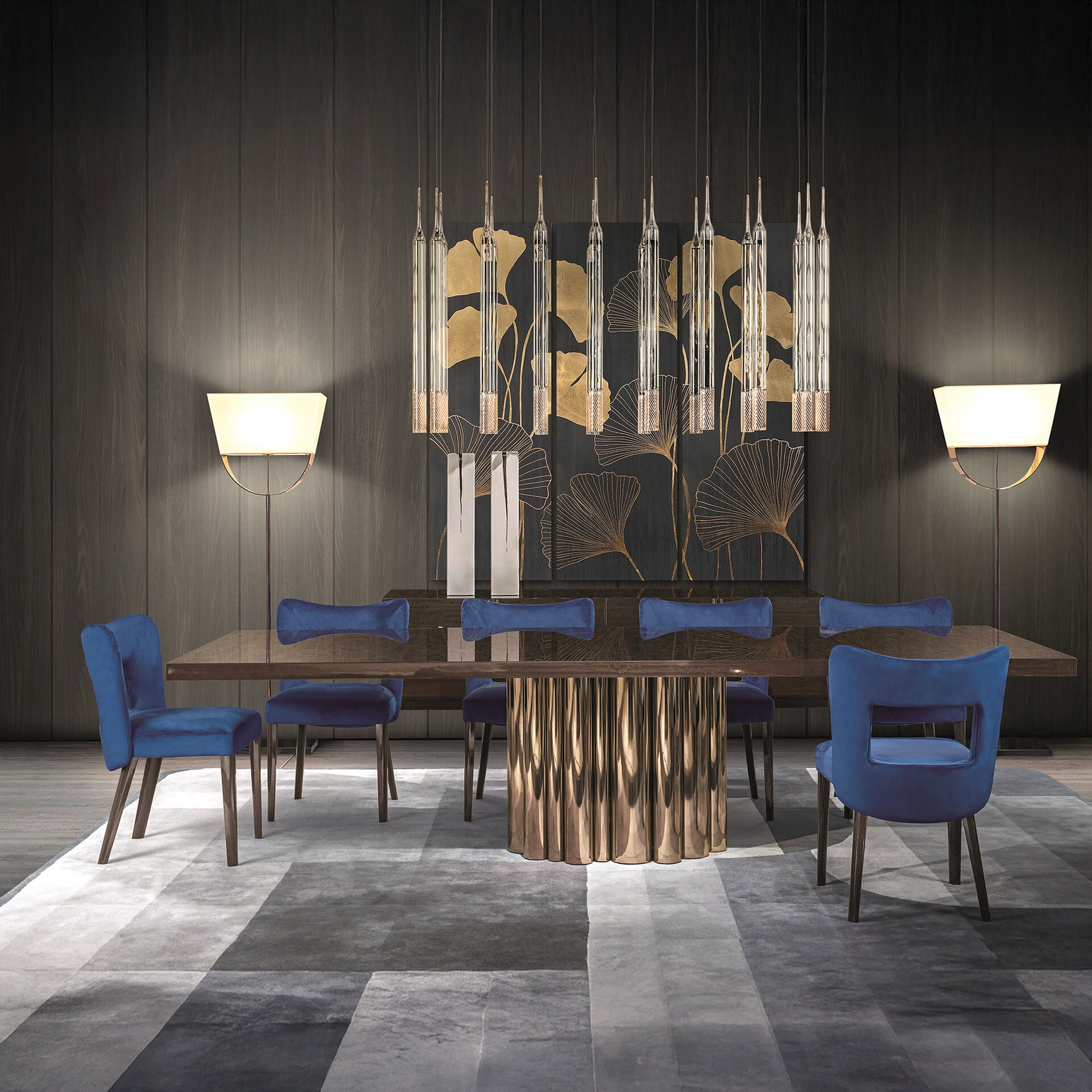 Stylish dining room featuring blue upholstered chairs, a sleek wooden table, and contemporary wall a.