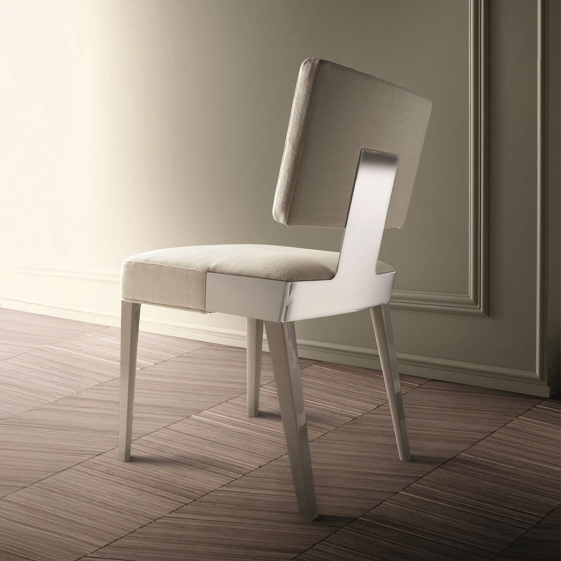 Elegant upholstered dining chair with a sleek design and neutral fabric finish.