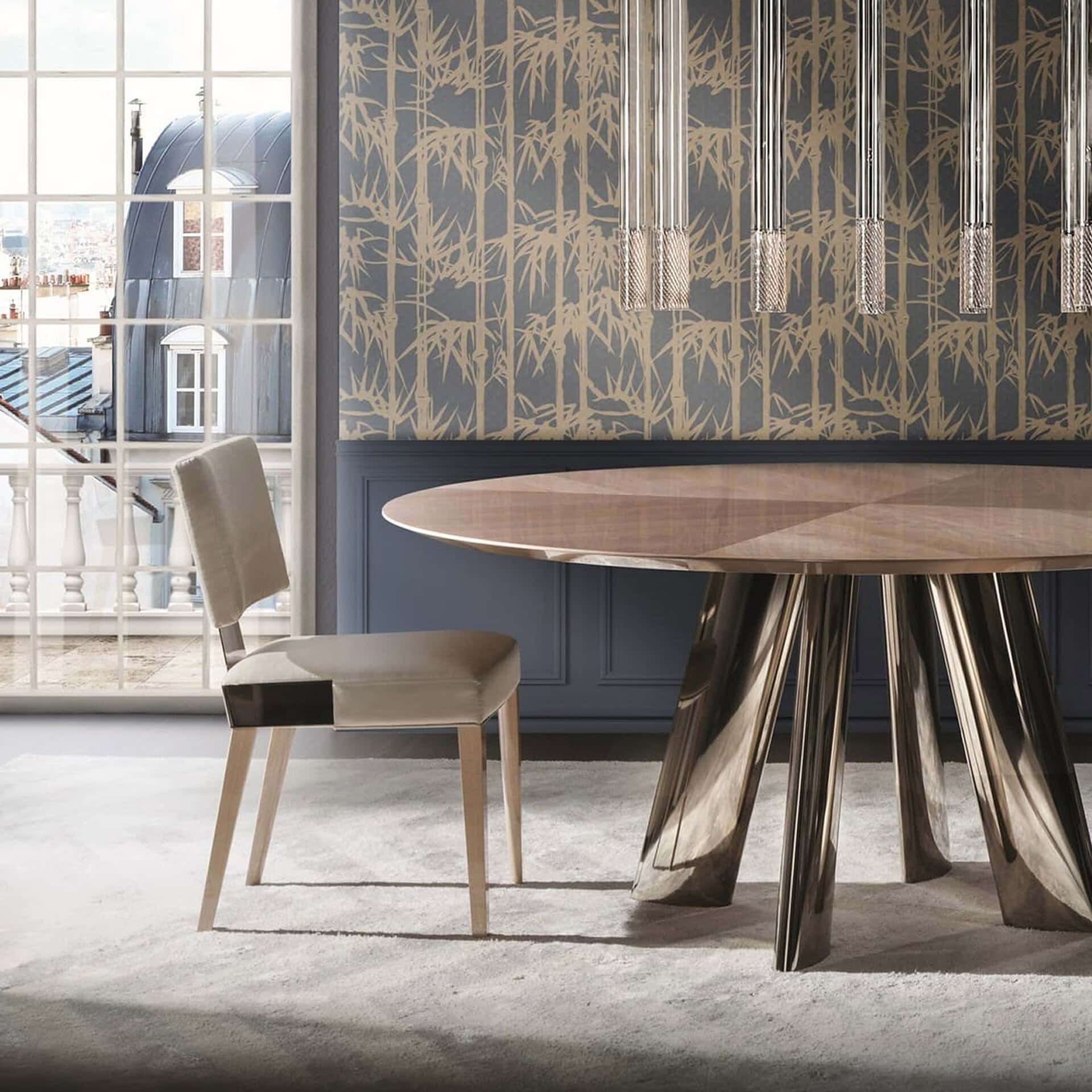 Stylish dining room featuring a contemporary wooden table and beige chair with decorative wallpaper.