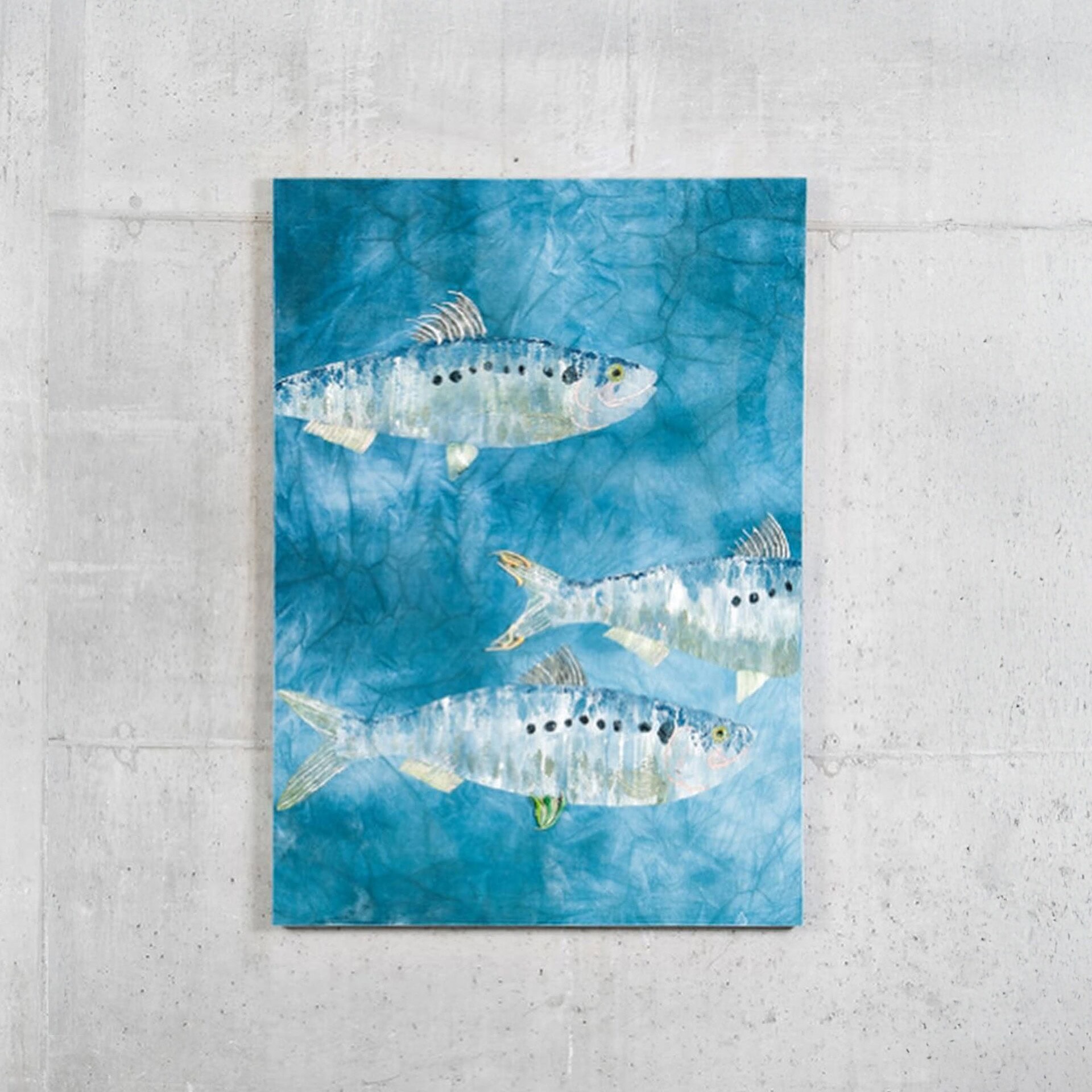 Full view of the Cepa Velvet Wall Tapestry showcasing fish motifs on a blue-green velvet background.