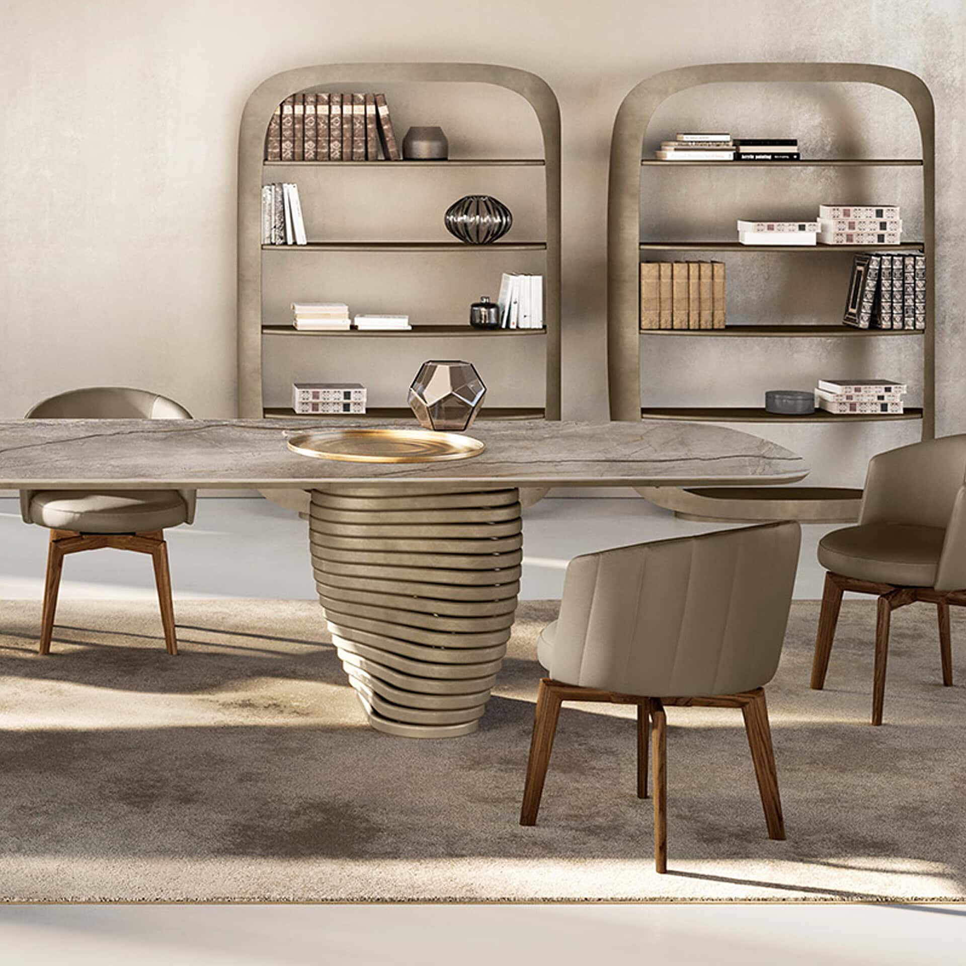 A modern dining room with a large marble table, unique wavy base, and light taupe chairs. Two arched bookshelves filled with books and decor stand against a textured beige wall.