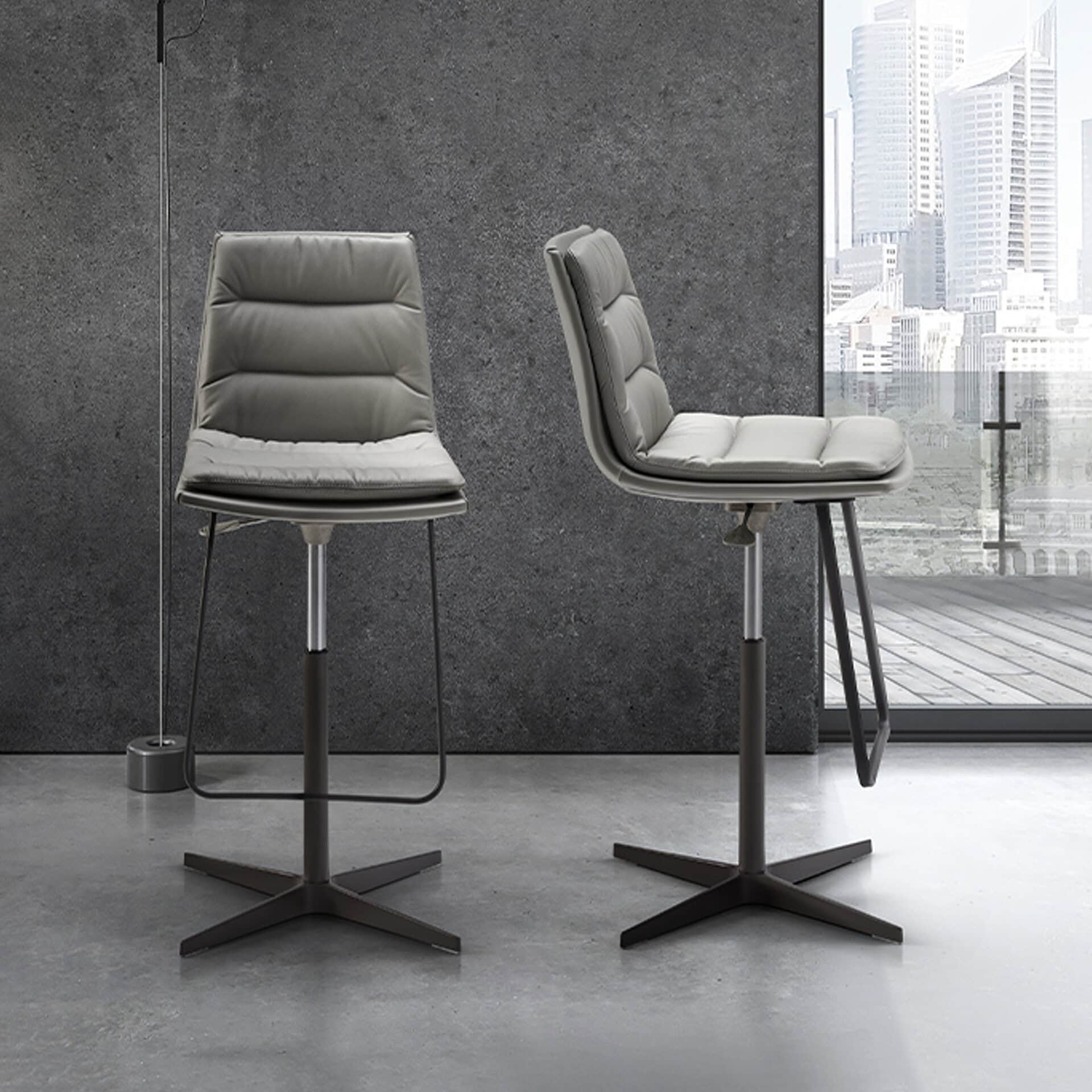 Lady Adjustable Swivel Stools in modern interior setting with upholstered seats and metal bases