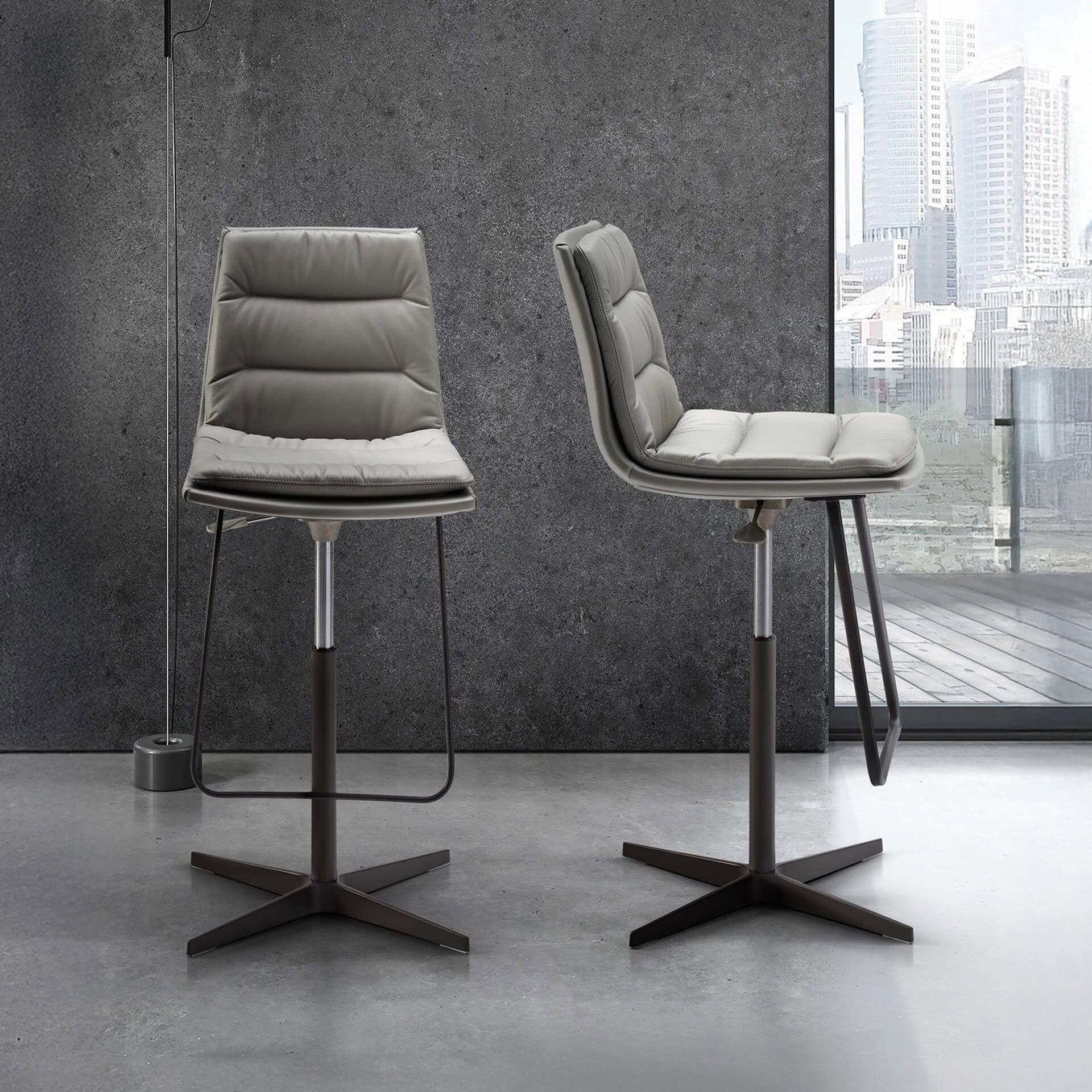Lady Adjustable Swivel Stools in modern interior setting with upholstered seats and metal bases