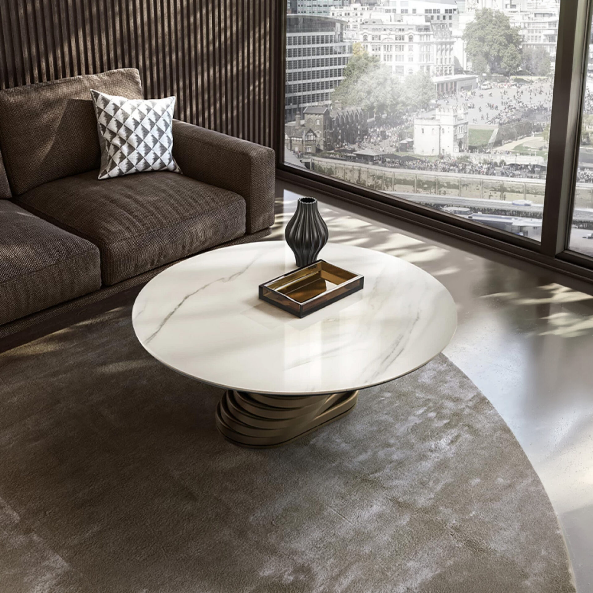 A modern living room with a round white marble coffee table, a brown sofa with a patterned pillow, and a large window overlooking a city.