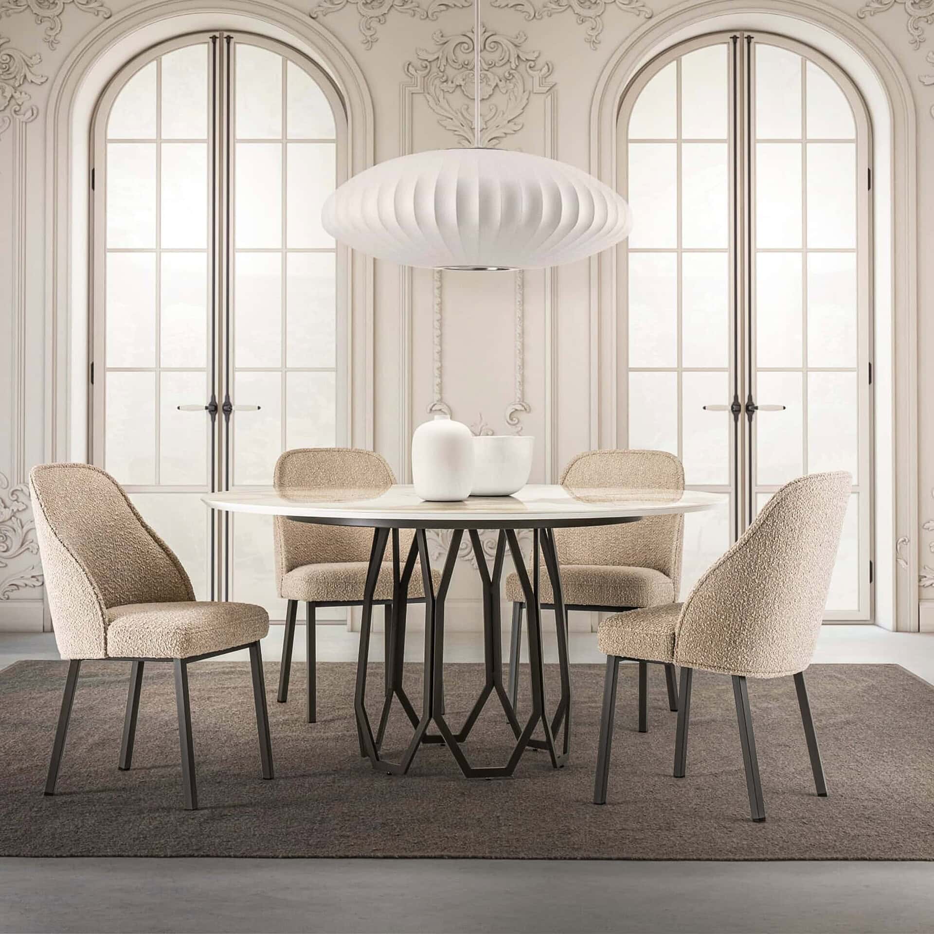Round Opal Geometric Dining Table with a black sculptural metal base and white top, styled in a classic dining room with arched windows and upholstered chairs.