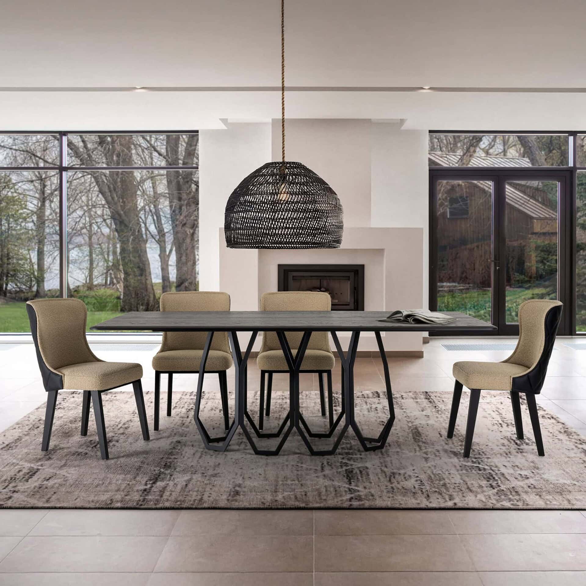 Rectangular Opal Geometric Dining Table in a modern dining room with a black sculptural base, paired with six upholstered chairs and a woven pendant light above.