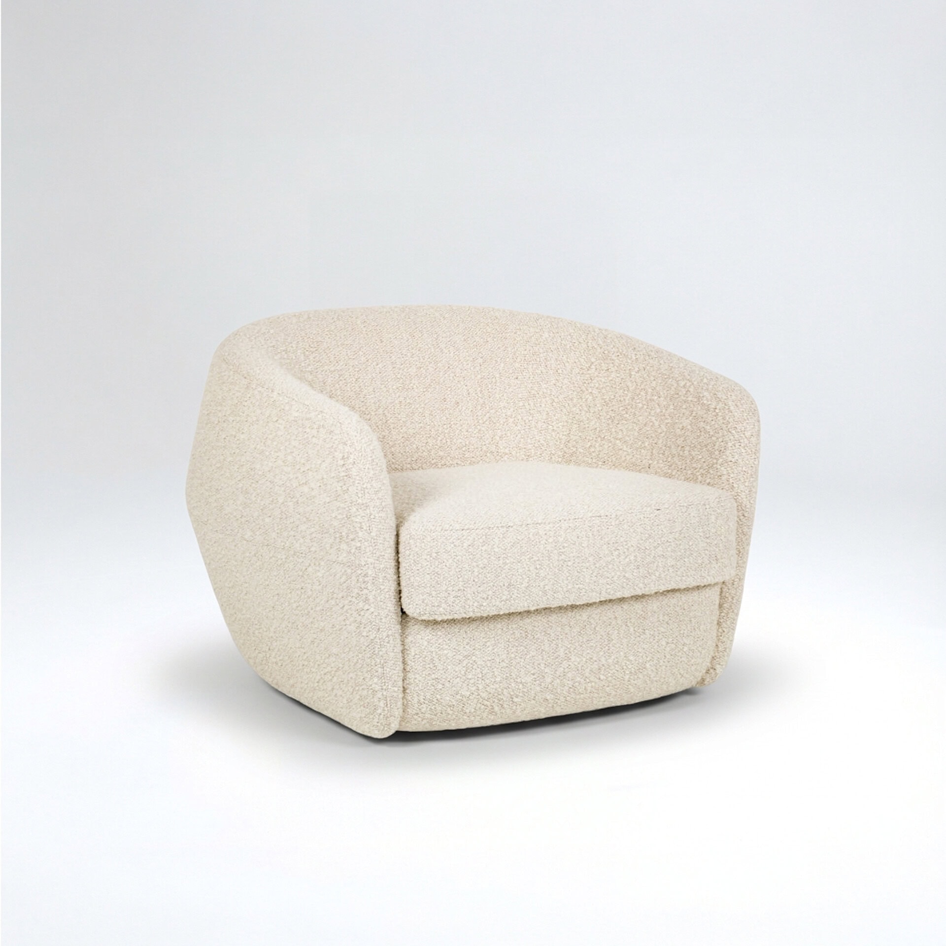 Cream upholstered armchair with rounded design for modern living spaces.
