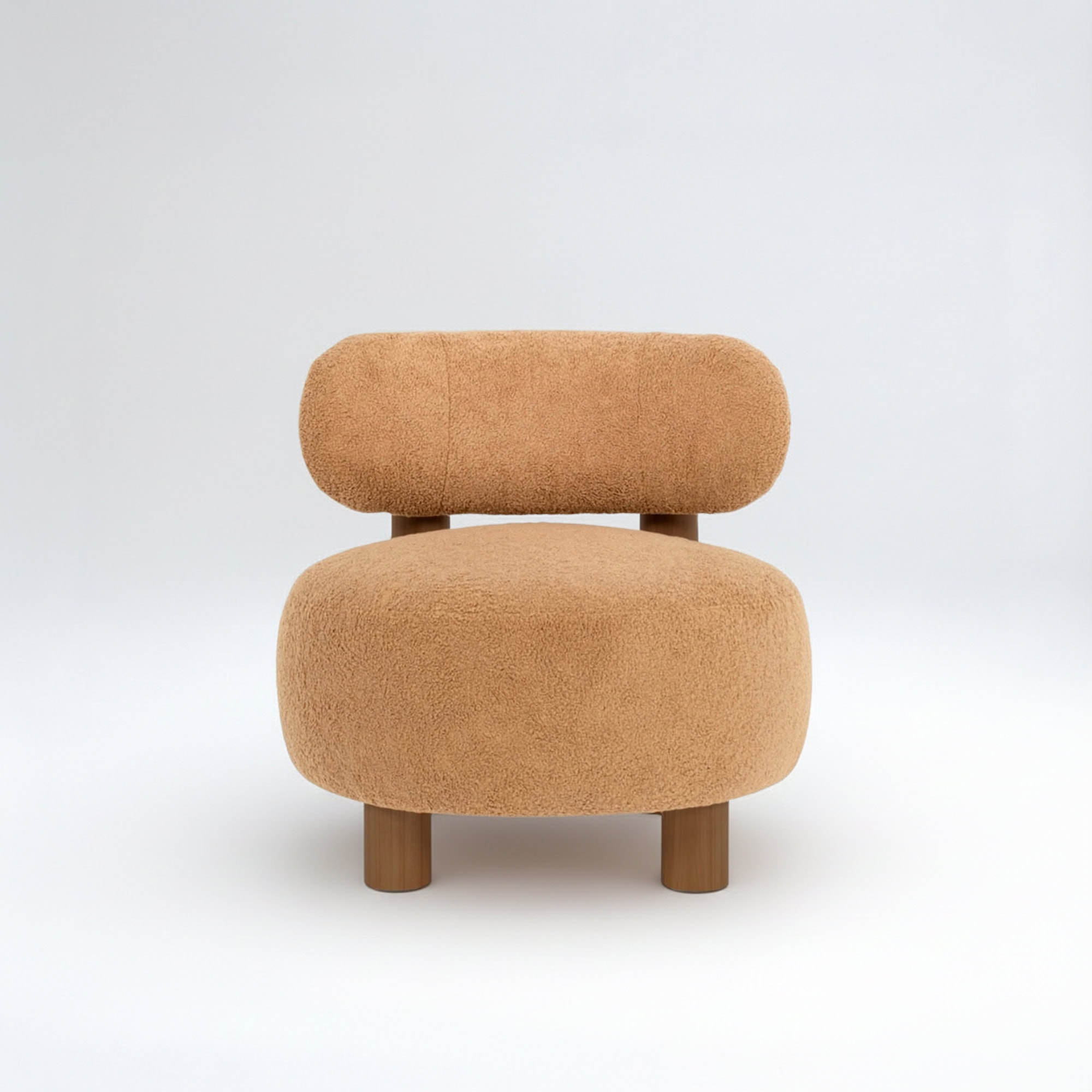 Modern Nicholas lounge chair with sculptural design and soft beige upholstery.