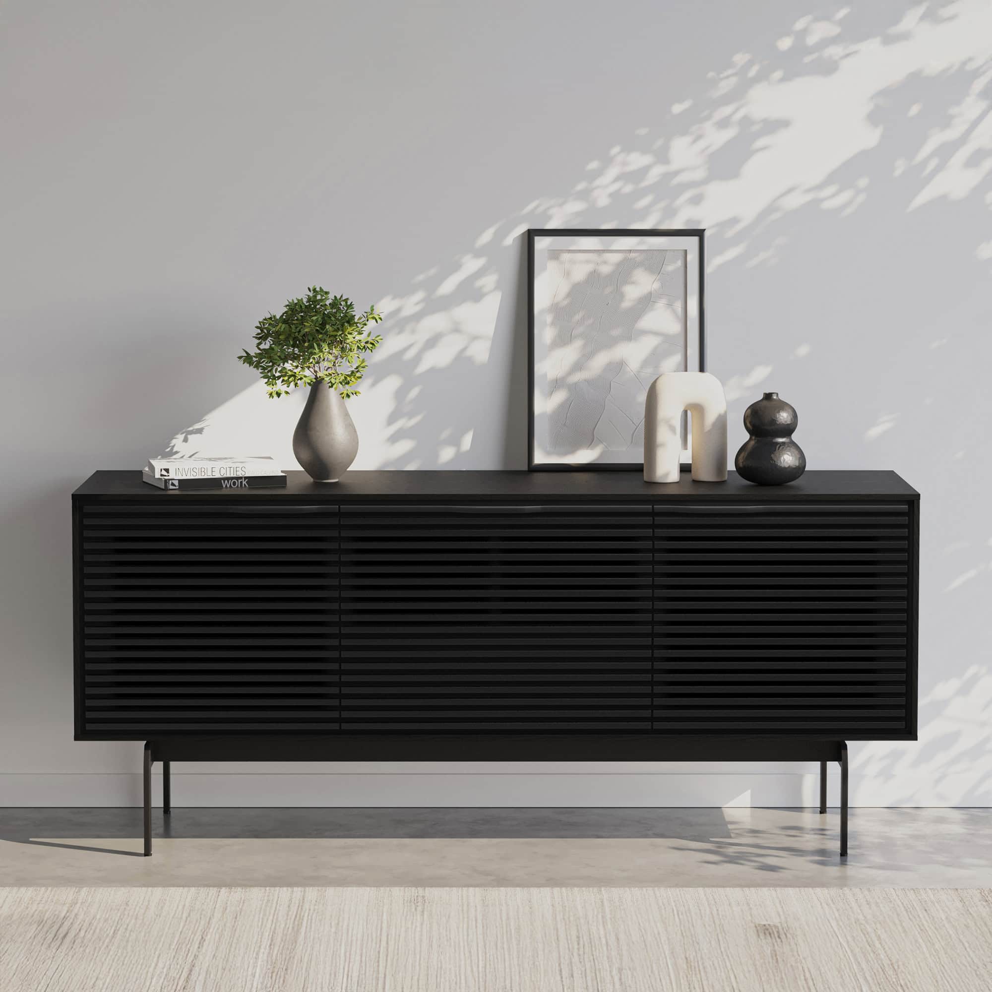 Black Align 7477 console in a contemporary living room with decor accents.