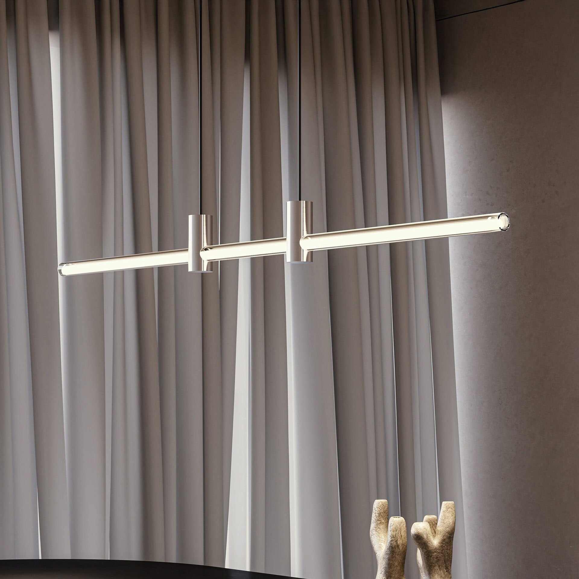 Contemporary hanging LED light fixture in modern home interior.