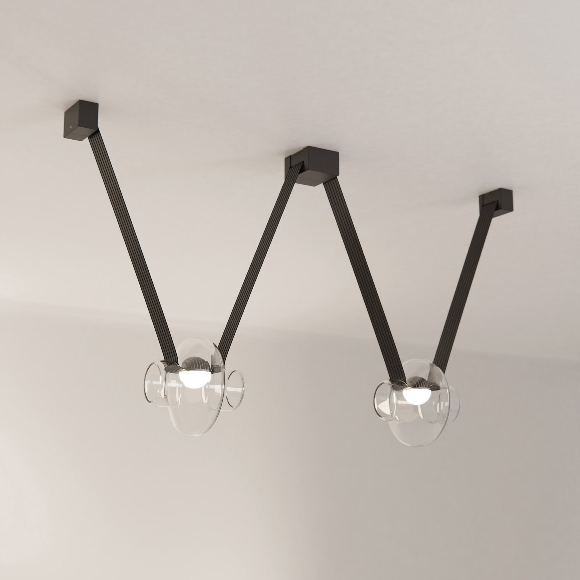 Modern black ceiling light fixture with glass shades, stylish and contemporary design.