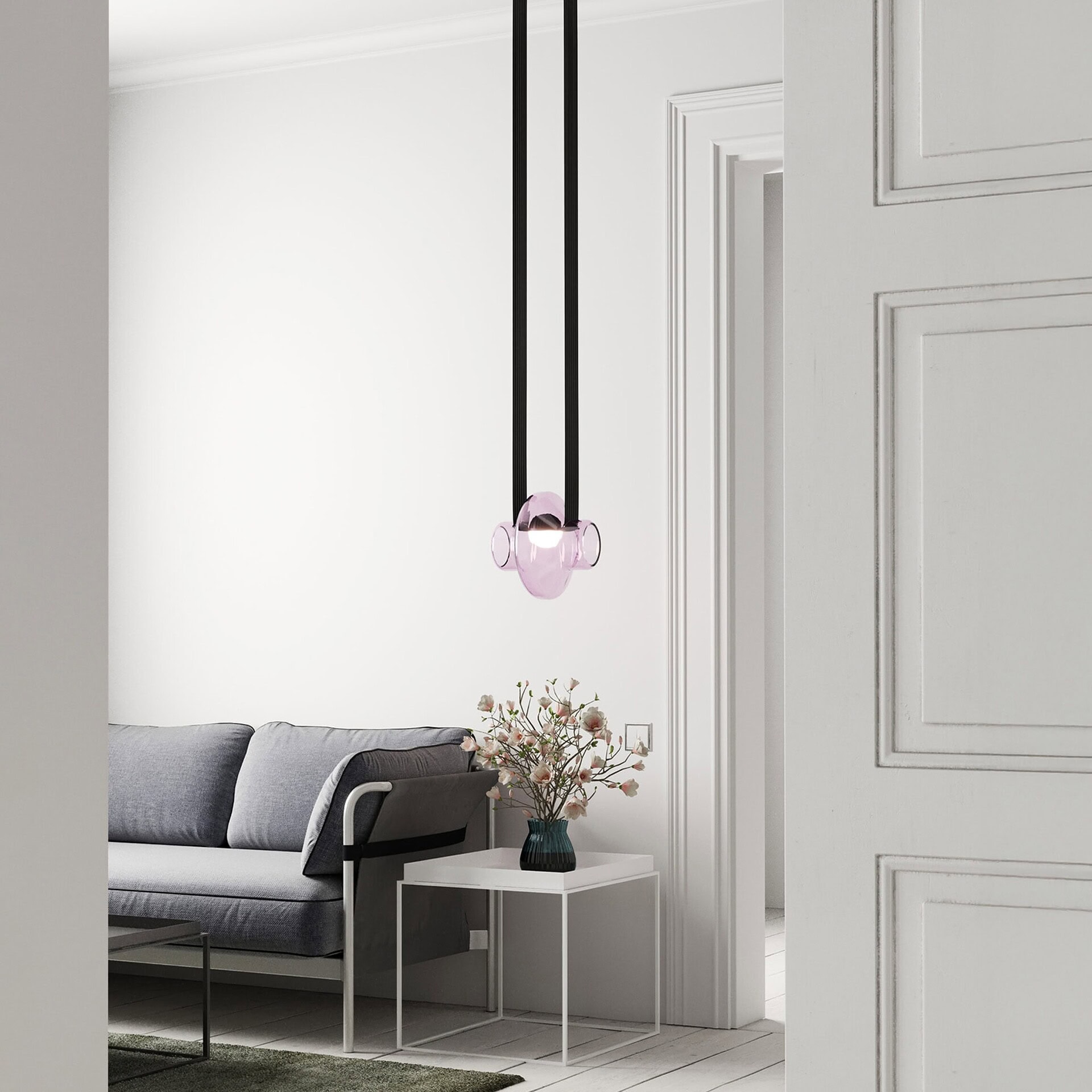 Elegant modern living room sofa with stylish pendant lighting by Sklar Furnishings.