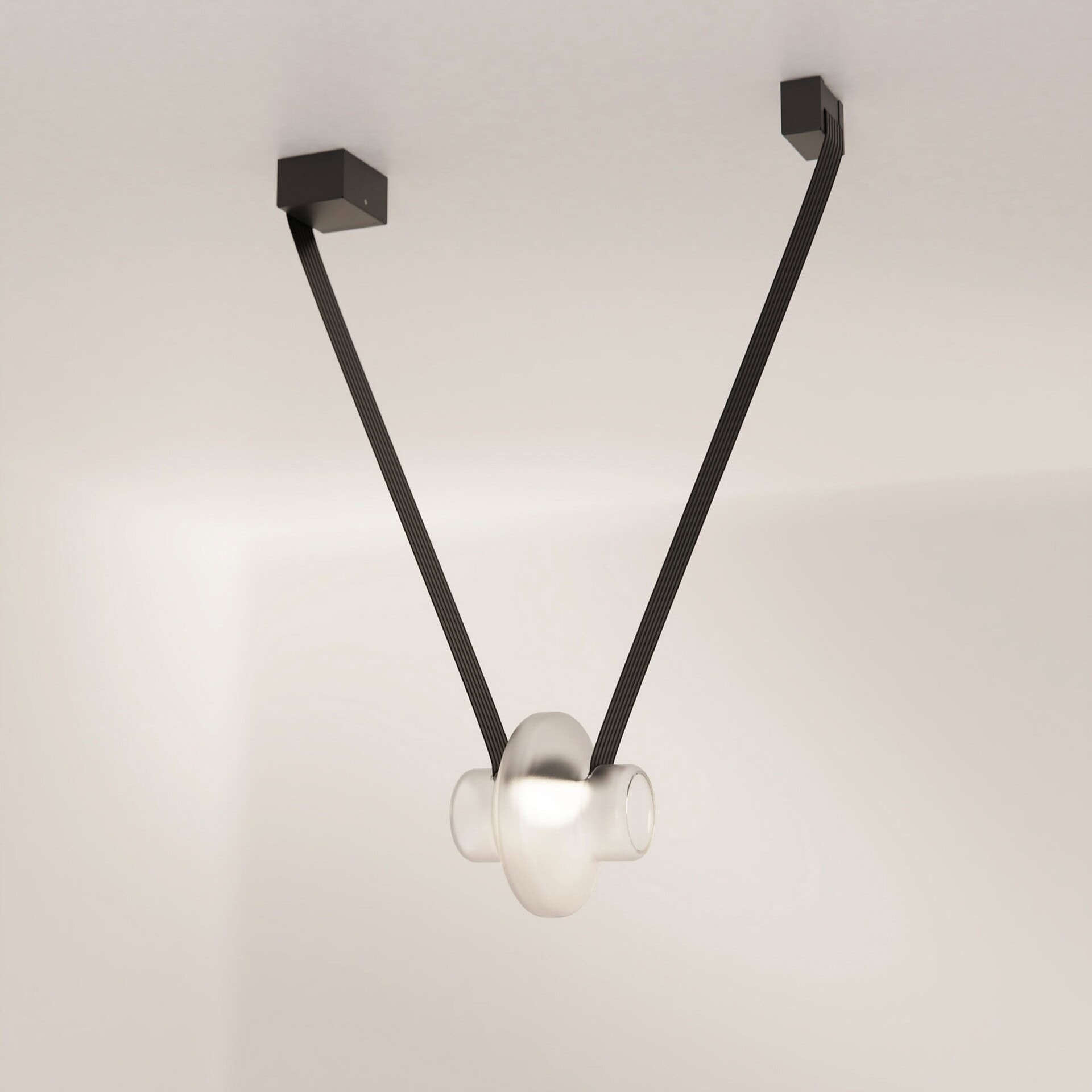 Modern pendant light fixture with sleek black cords and elegant glass shade for contemporary interiors.