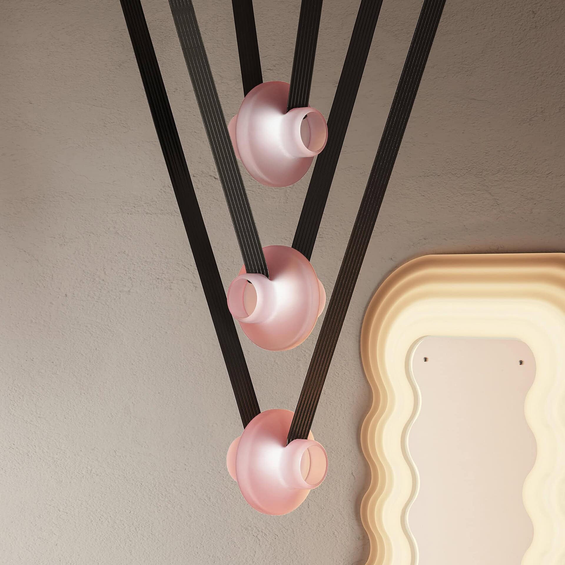 Modern black and pink dining pendant lights with a minimalist design, suitable for contemporary interiors.