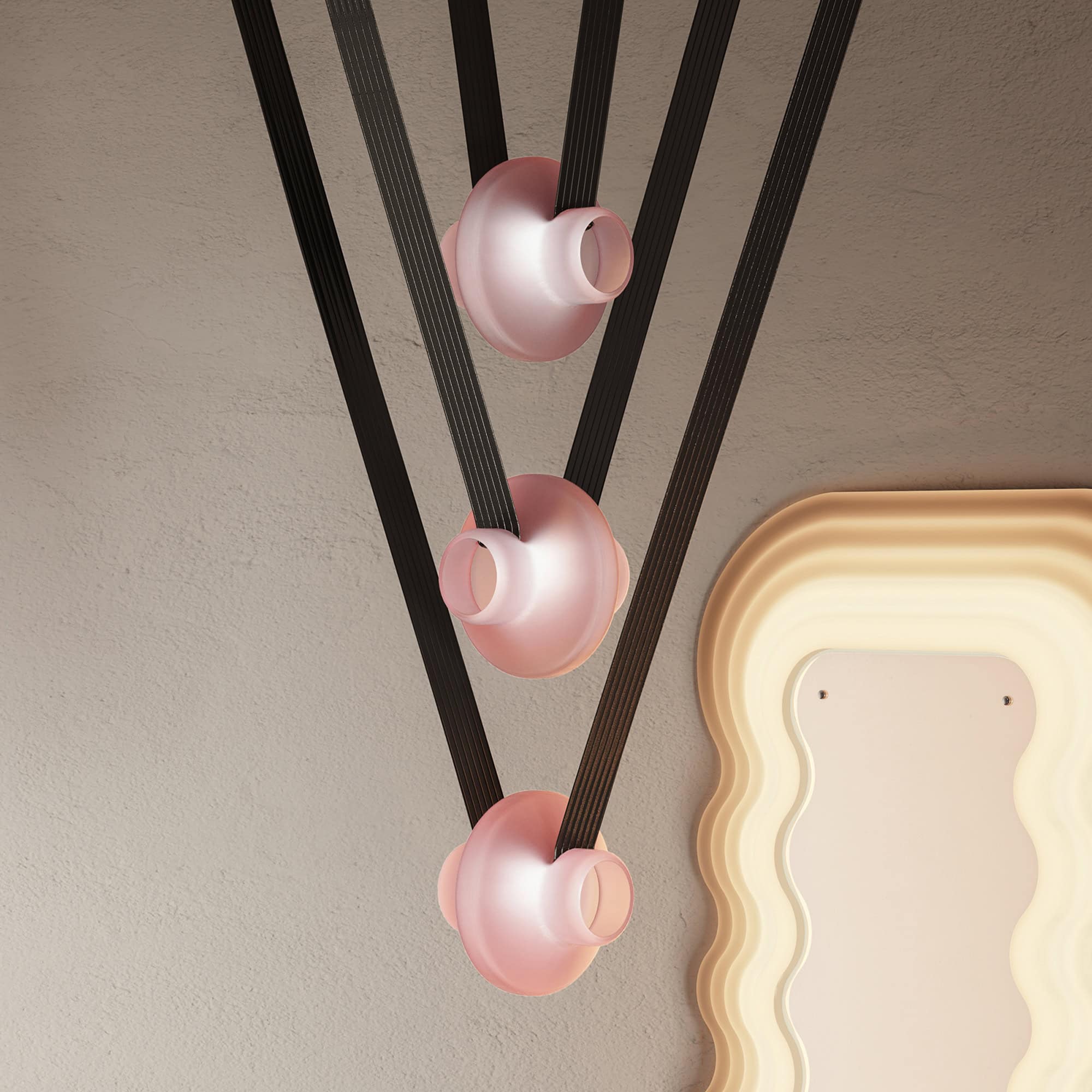 Modern black and pink dining pendant lights with a minimalist design, suitable for contemporary interiors.