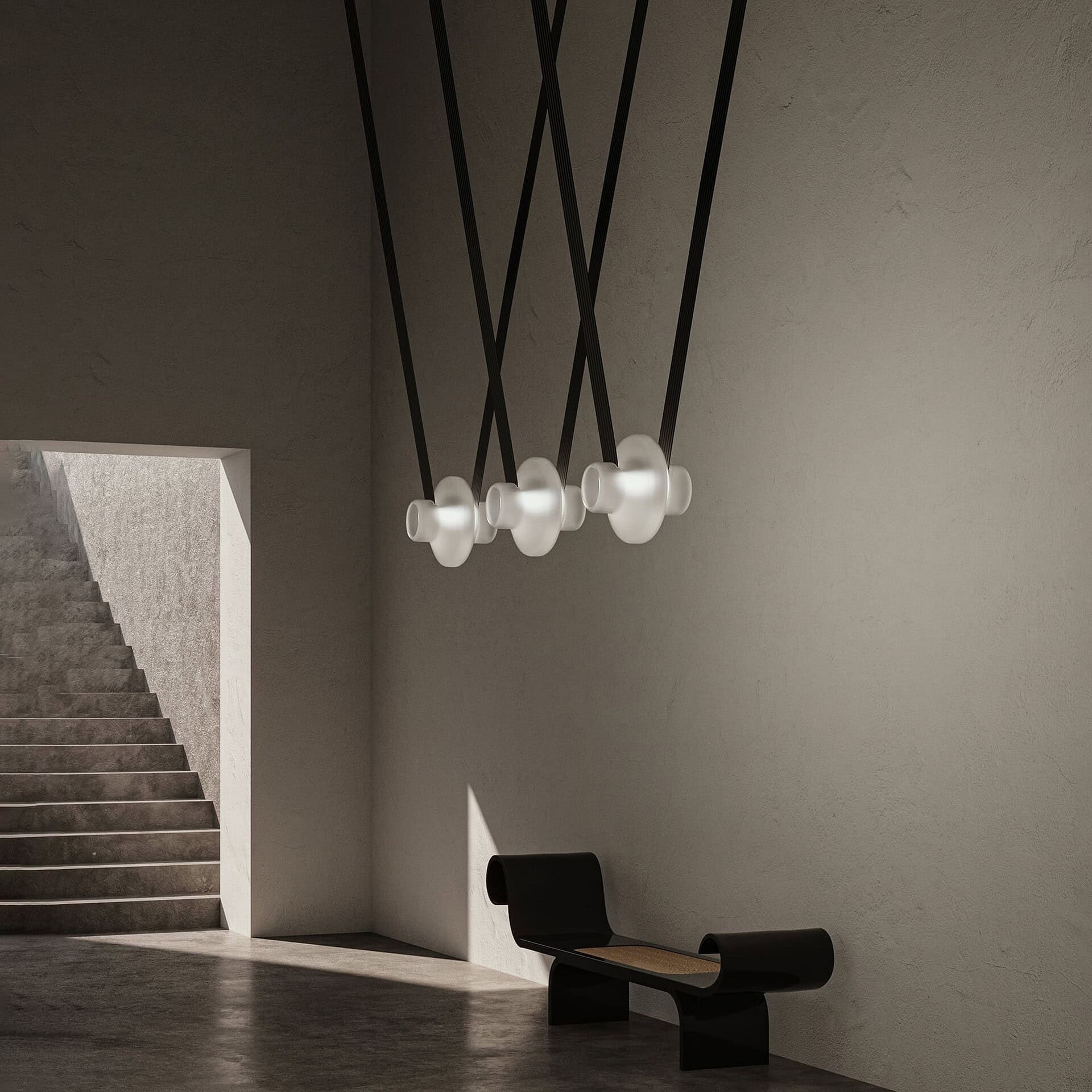 Contemporary black and white modern pendant lighting fixture in minimalist interior design.