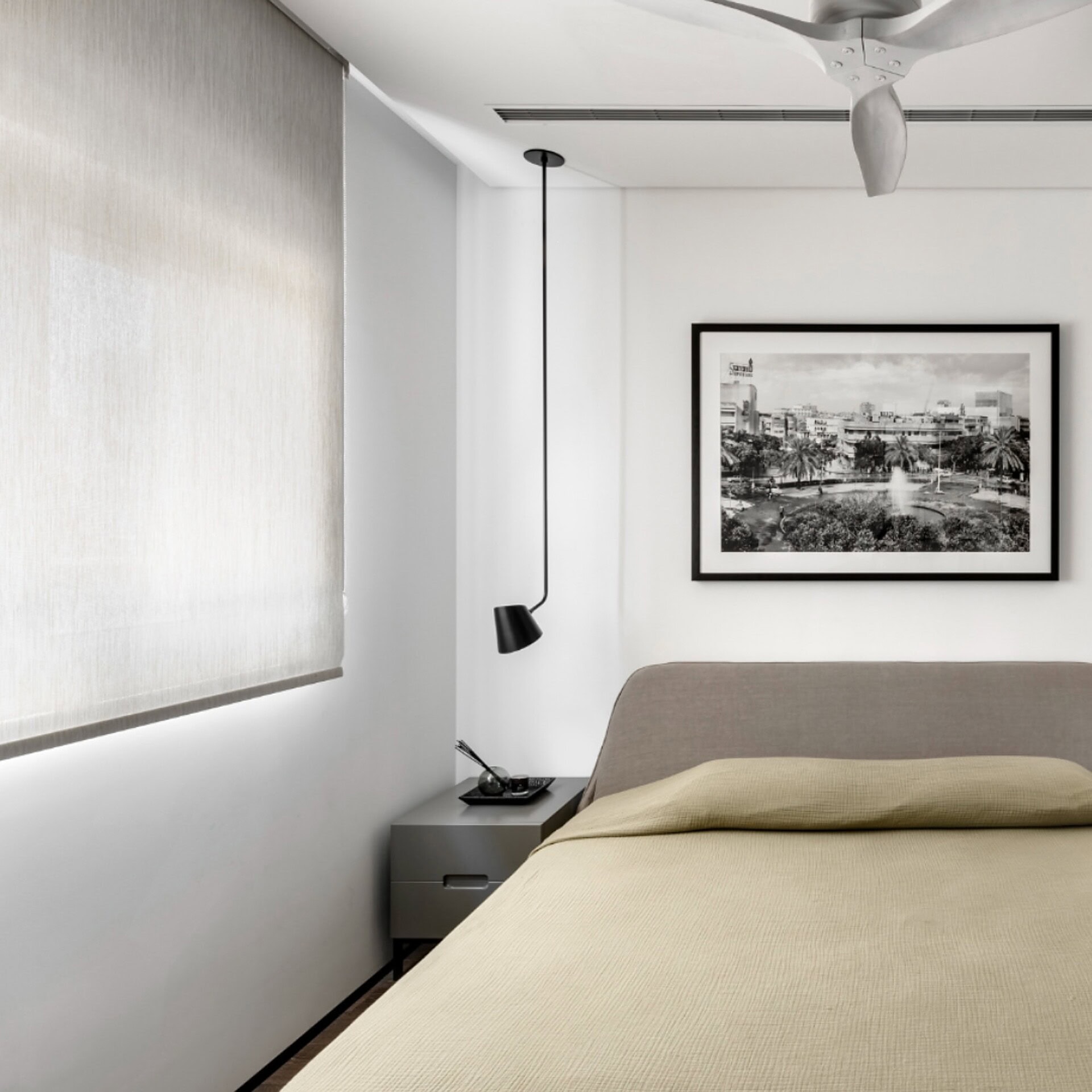 Modern minimalist bedroom with sleek furniture and neutral tones for contemporary comfort.