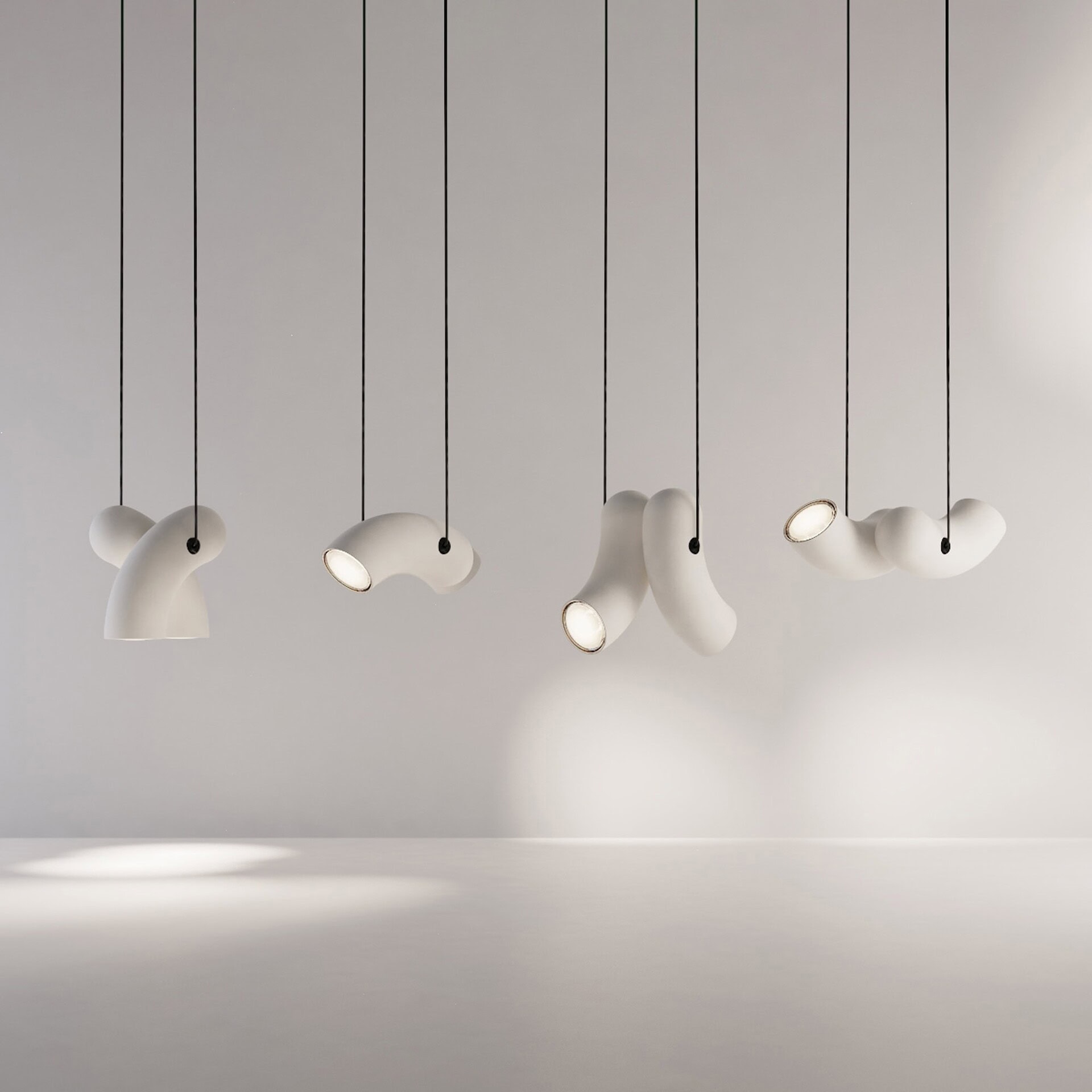 Contemporary white pendant lighting fixtures by Sklar Furnishings.
