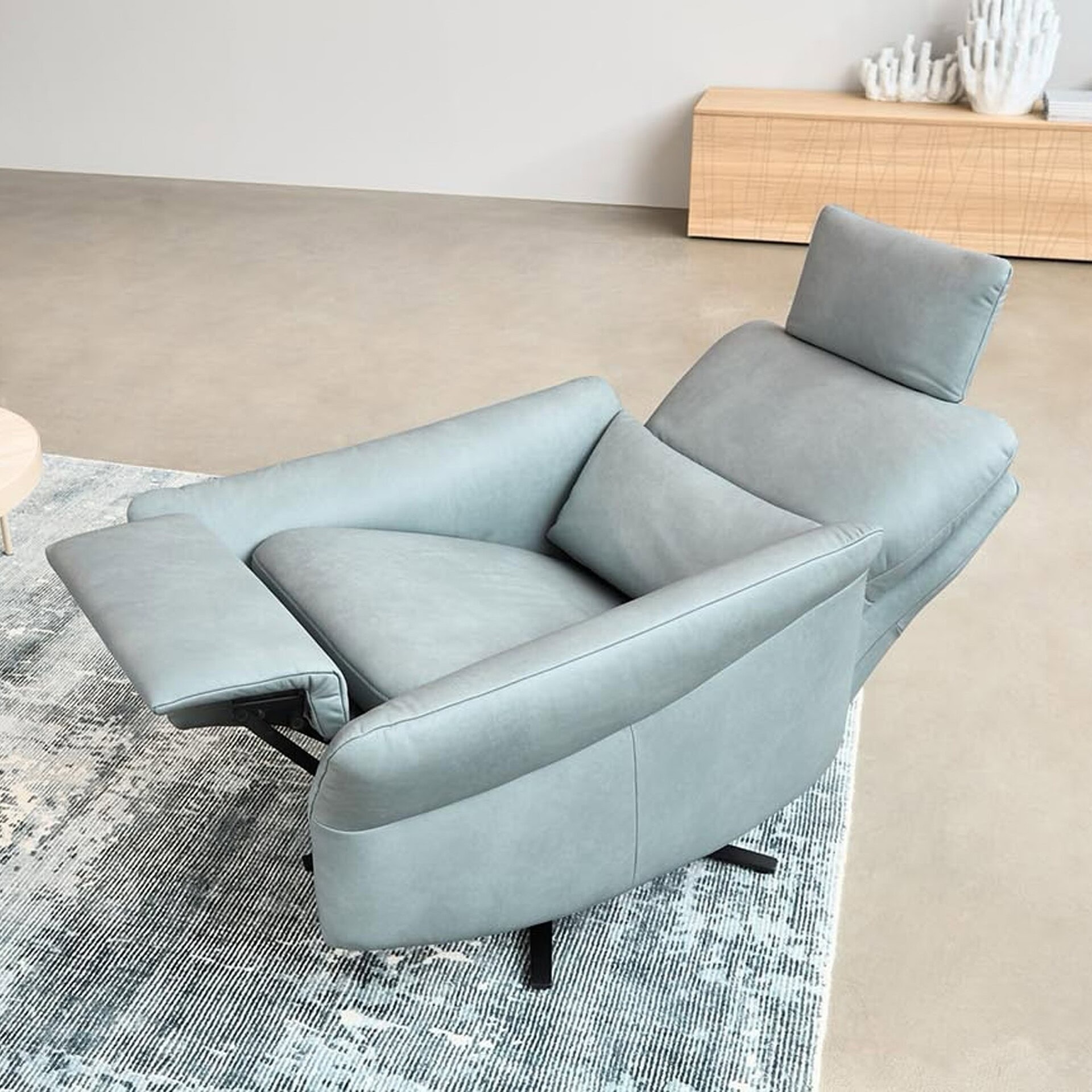 Cumurex 7270 Recliner in light blue fabric shown in a modern living room setting.