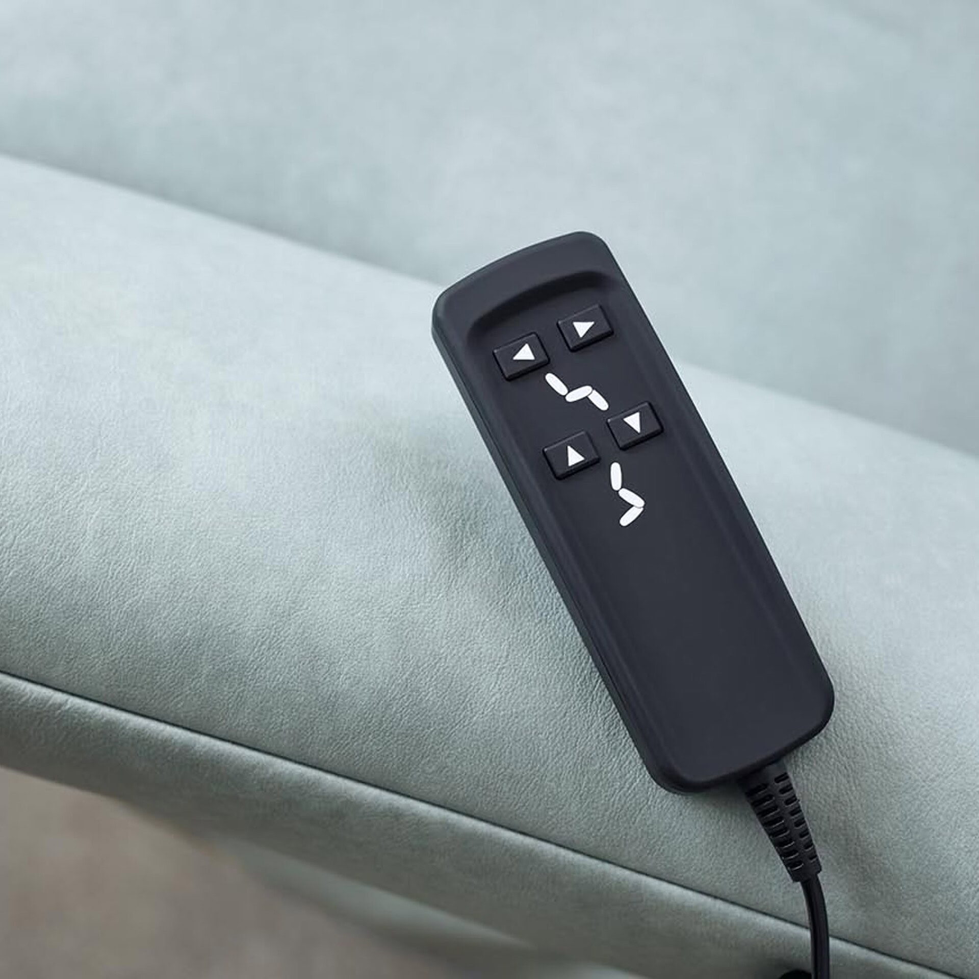 Detail view of Cumurex 7270 Recliner remote control for electric operation.