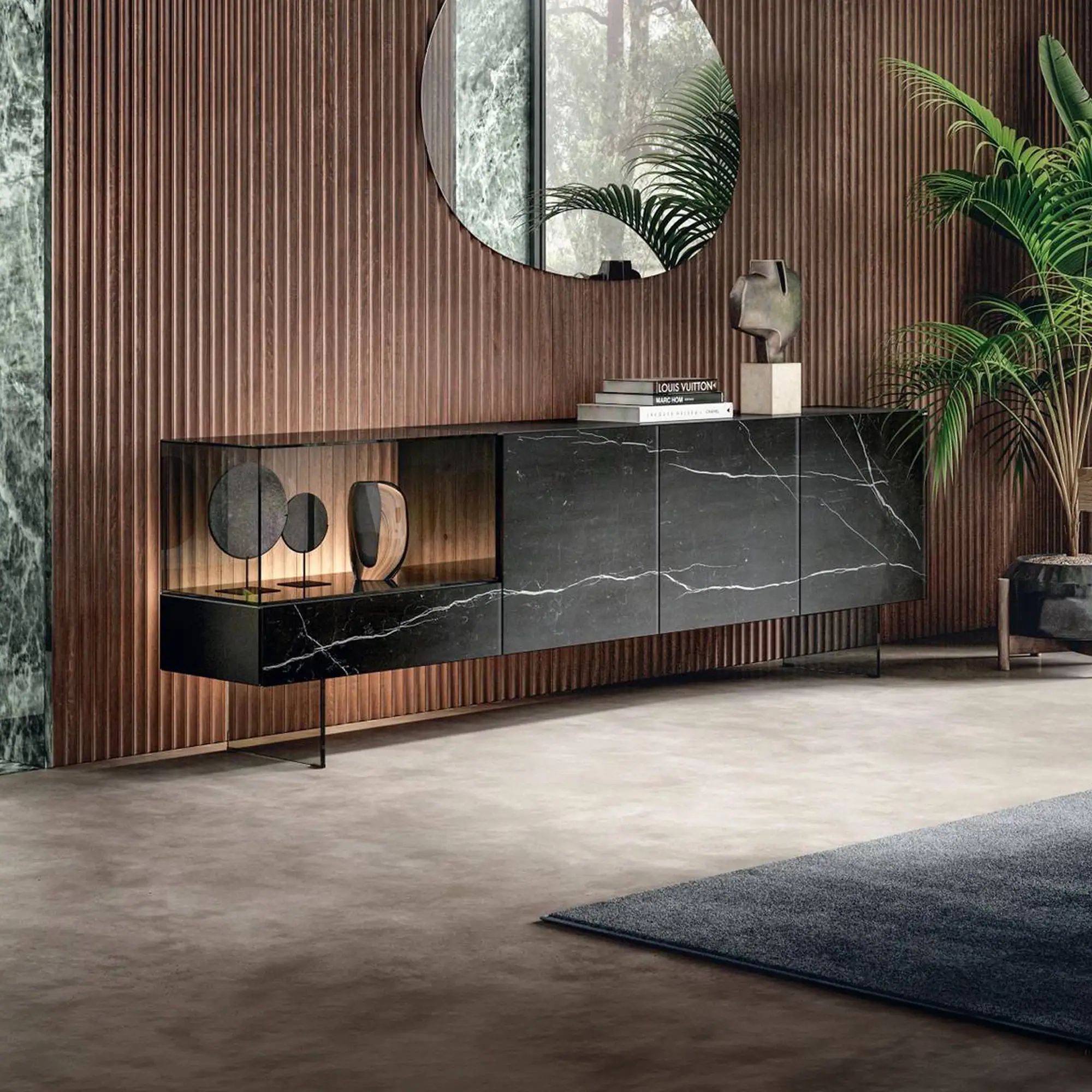 Sklar Furnishings glass sideboard with black marble finish and decorative objects.