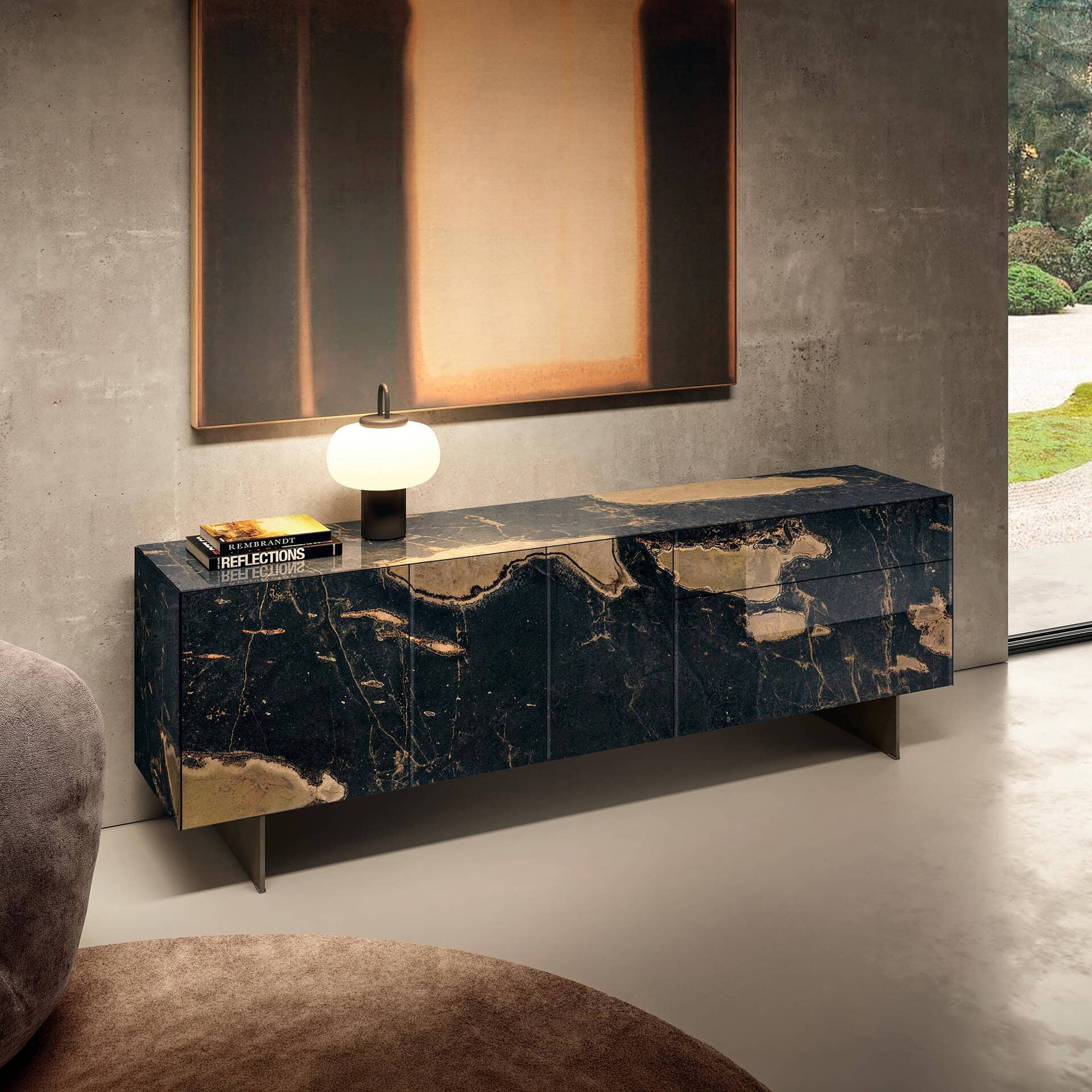 Elegant black and gold marble console table in contemporary living room.